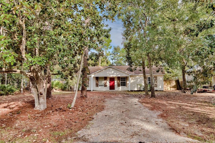 Ideally located on a large lot among the peace and privacy of Point Washington State Forest, 72 Mason Avenue sits on a quarter acre, just a short walk from the Choctawhatchee Bay and minutes from 30A's storied beaches, bike trails, dune lakes, restaurants, and shops. This home, perfectly suited as a primary residence or as an investment property with long-term rental potential, features 3 bedrooms and 2 full baths, 10 foot vaulted ceilings in the main living areas with tile and laminate throughout - no carpet! - and a huge fenced in backyard with a custom deck that's perfect for both family life and entertaining. Point Washington sits on the southeast corner of the bay and possesses an Old Florida charm all its own - covered in pine forests, flanked by grassy bayous. Flood Zone X!!!