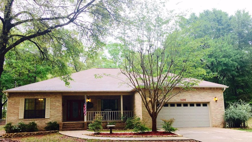 UPDATED 4 bedroom, 2 bath, plus formal dining room, ALL-BRICK custom home, set on a FULL ACRE, low maintenance lot. This property is in a beautiful part of Crestview. This home has a large covered front porch, hardwood flooring and tile throughout (carpet in bedrooms), custom kitchen with beautiful granite countertops and custom cabinets.Large master bedroom can easily accommodate large furniture. Master Bath has double vanities, soaking tub and separate shower. Laundry room is HUGEs and features an area for a desk and small home office. The backyard is large has a chain link fence, HUGE workshop 14x24 with water, electricity, and cable. There is a large covered back porch, and paver patio.There is a sprinkler system for the yard, a composting station. Seller is providing a home warranty