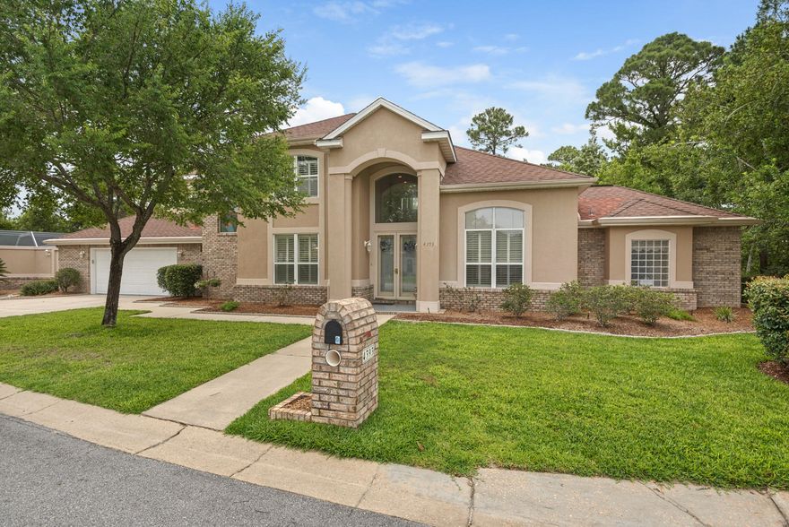 A++ for curb appeal! This custom built, well cared for home at the end of a cul-de- sac in gated Southwind in Bluewater Bay is move in ready and sure to please. Come to your Sanctuary in the Backyard with Nature all around! Spectacular Views from the entire back of the home that's backs to protected wetlands and best of all it's private! Very large screened enclosure that houses the pool, hot tub and hand painted beach mural is amazing!! It is perfect for entertaining or private relaxation. Master bedroom on the main level boasts two large his and hers closets as well as a separate sitting area; and a Master Bath with cultured marble shower and separate jetted tub. On first floor office there is crown molding and trey ceilings. The dining room has chair railing and crown