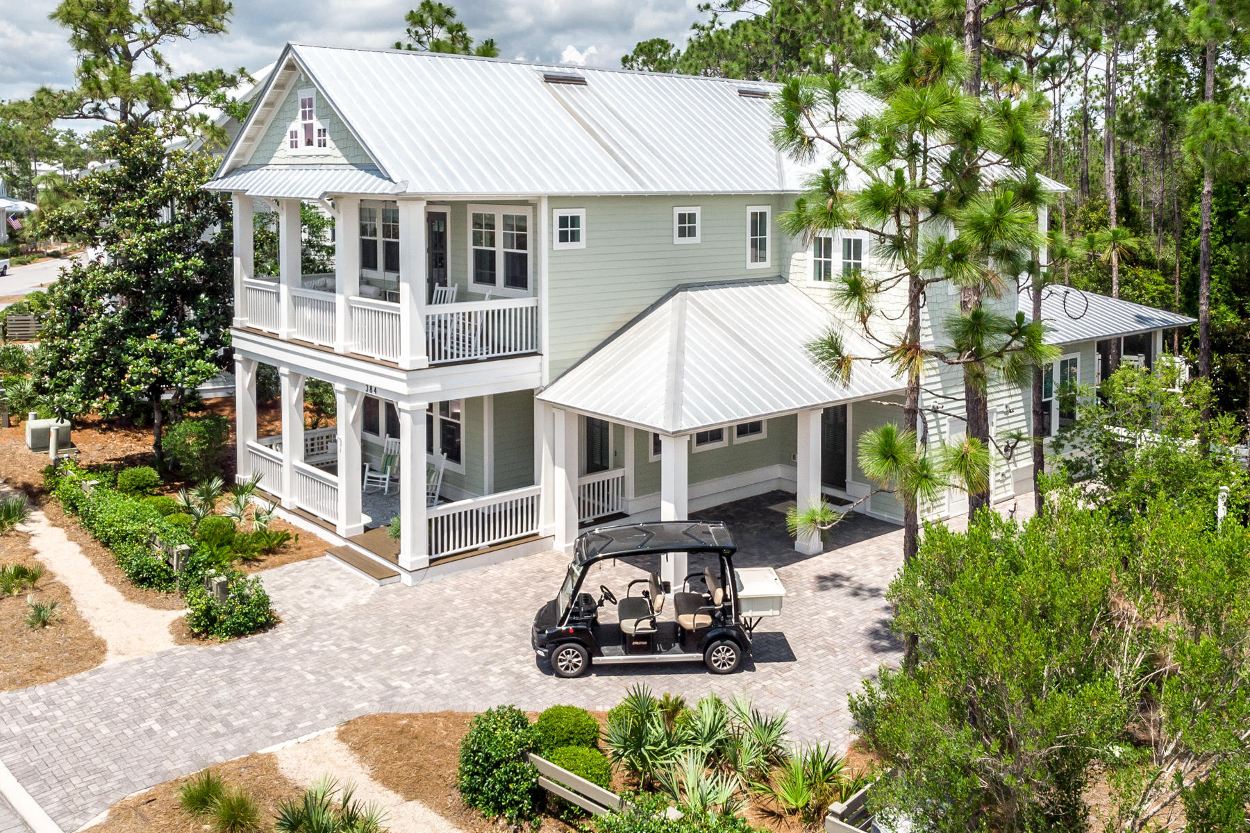 Welcome to the quieter side of Watercolor! This beautifully decorated home in Phase 4 of Watercolor checks all the boxes for resort living. From its inviting front porch to its 3271 square feet, the home provides an abundance of living and entertainment space for family and guests. Located downstairs is a Jr master suite, separate office space, open kitchen and living area, with a separate dining area. The screened porch overlooks a very inviting heated pool and a private wooded back yard. Upstairs is a large master suite, 2 additional bedrooms, each with its own bath, a sitting area, plus a 4 bed bunk room. Luxury, quality, and privacy in an amazing home, don't miss this opportunity. Call today to tour this beautiful, spacious home!!