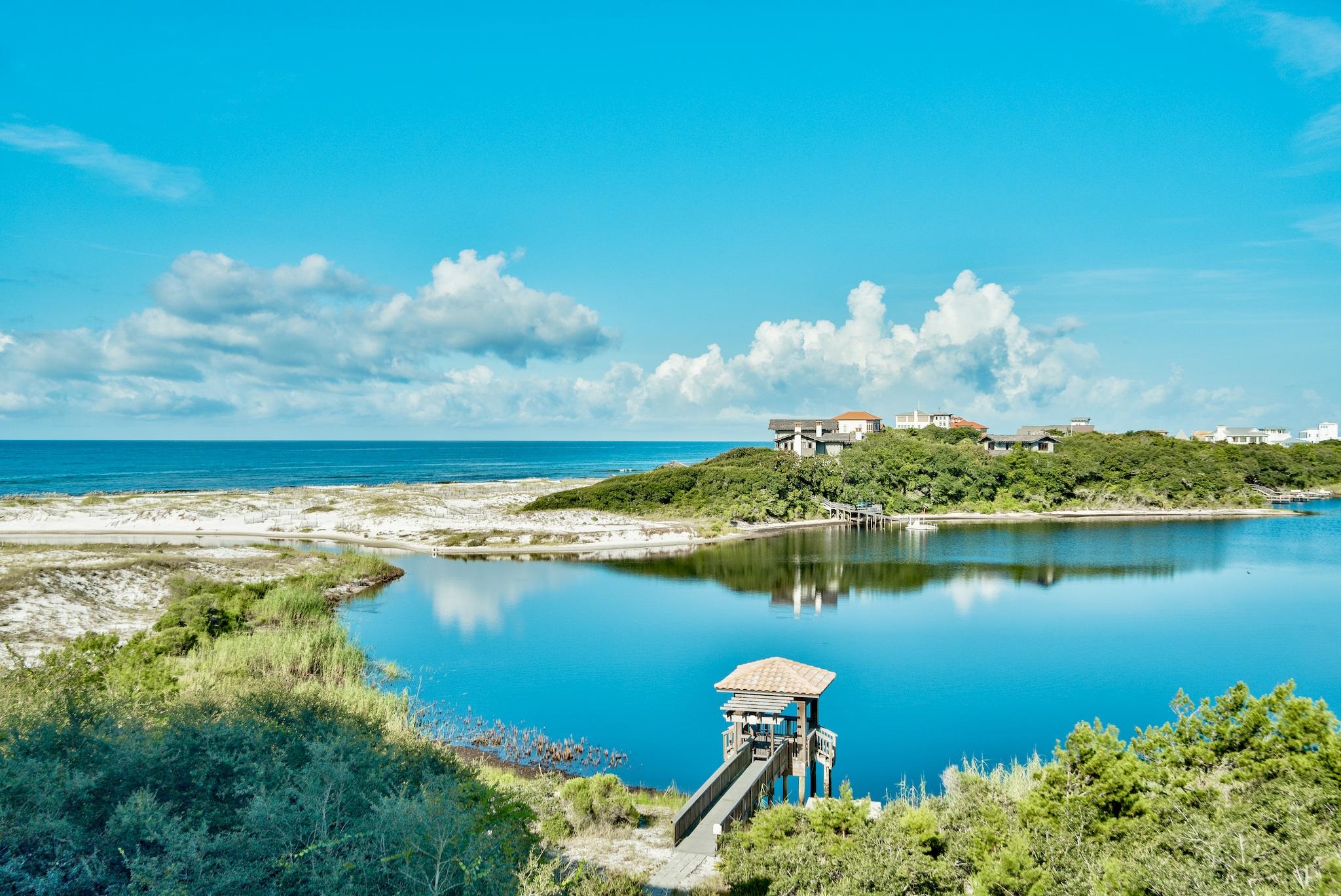 Amazing opportunity to own this top floor two level luxury condominium residence in Sanctuary by the Sea with Gulf & Lake views! This home is priced to sell and is offered fully furnished. This third floor unit offers remarkable westerly views of Big Red Fish Lake and the Gulf of Mexico. This 4 bedroom 4.5 bath two story home has two master bedrooms. The first floor offers one master off of the waterfront balcony and two additional bedrooms with private baths, laundry room, hall bath, open living and dining area with a gourmet kitchen, granite counter tops, custom cabinetry, and a 10' x 38' covered balcony. The second large master bedroom (800 sq ft)is located on the second level with a massive 22' x 38' balcony boasting a forever western view of Big Red Fish Lake & the Gulf of Mexico.