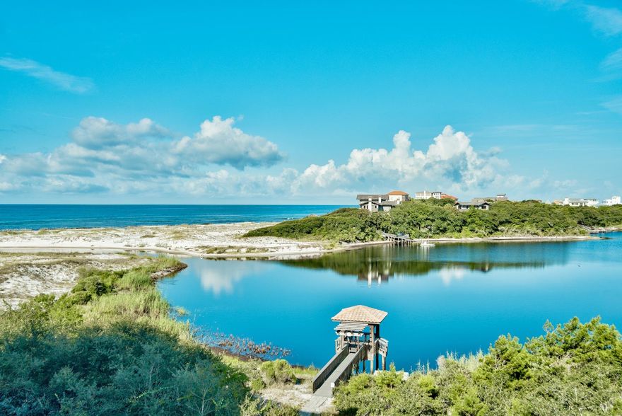 Amazing opportunity to own this top floor two level luxury condominium residence in Sanctuary by the Sea with Gulf & Lake views! This home is priced to sell and is offered fully furnished. This third floor unit offers remarkable westerly views of Big Red Fish Lake and the Gulf of Mexico. This 4 bedroom 4.5 bath two story home has two master bedrooms. The first floor offers one master off of the waterfront balcony and two additional bedrooms with private baths, laundry room, hall bath, open living and dining area with a gourmet kitchen, granite counter tops, custom cabinetry, and a 10' x 38' covered balcony. The second large master bedroom (800 sq ft)is located on the second level with a massive 22' x 38' balcony boasting a forever western view of Big Red Fish Lake & the Gulf of Mexico.