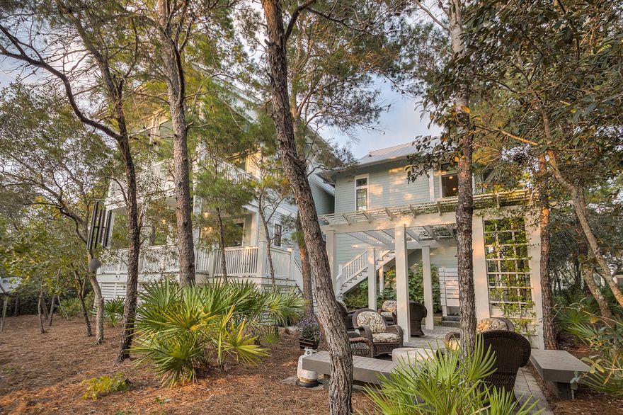 This beautiful non rental WaterColor home is located on arguably one of the best phase 2 lots. Backing up to green space with views of Western Lake, green space on one side and a nice park across the street the privacy is hard to beat. The extra wide lot easily accommodates a full 2 car front entry garage and offers ample parking. The outdoor spaces include 4 covered porches and a grilling area and patio, a pool should be easy to add. 5 bedrooms, hallway bunks, 5.5 bath means there is plenty of room for the entire family and even some friends. The kitchen has plenty of work space, high end appliances and is open to living/dining area.