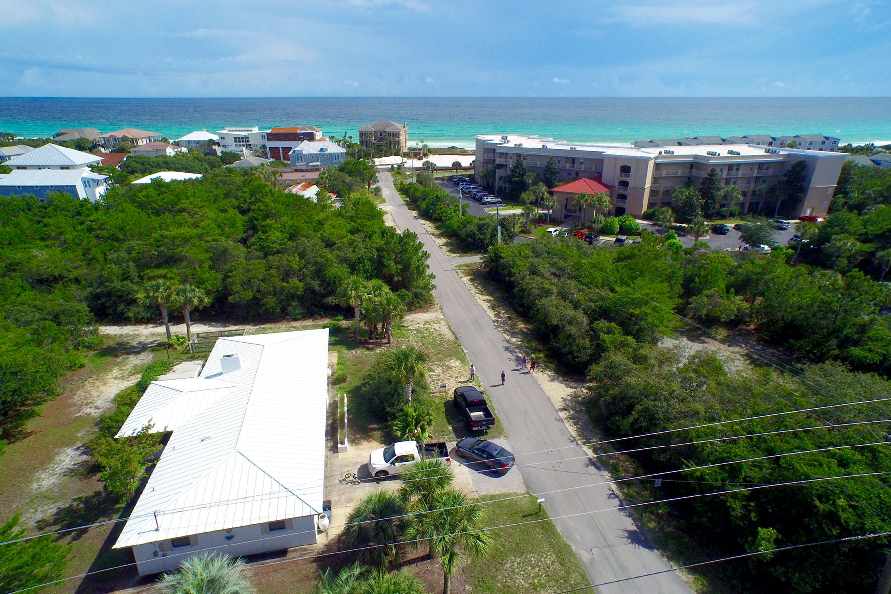 Discover this quaint beach cottage ideally located South of 30A with deeded beach access and central to all of the shopping, dining and entertainment 30A has to offer. Perfectly situated on over a quarter acre of land, this lot has the opportunity to produce gulf views. Recently remodeled, this gorgeous coastal cottage evokes a cozy atmosphere, fully furnished with designer details and eclectic finishes. The layout is extremely open and features a nice sized kitchen, large living room with floor to ceiling wood burning brick fireplace, spacious sunroom, dining room and a split bedroom plan. The outdoor space is incredible, with exceptional opportunity for expansion, this parcel has it all.