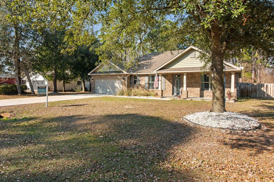 Welcome to this well-maintained home in the heart of Navarre! The fully fenced backyard with a privacy fence and open patio offers the perfect setting for entertaining, relaxing, or enjoying Florida evenings outdoors. Inside, the bright and airy interior features tray ceilings and crown molding in the living room, creating a refined yet inviting space. Recent updates extend into the bedrooms, where crown molding and stylish board-and-batten accents add character and a custom touch. Hardwood and tile flooring flow throughout the home, and granite countertops provide a timeless finish in the kitchen. Thoughtfully updated and move-in ready, this home blends comfort, style, and functionality.