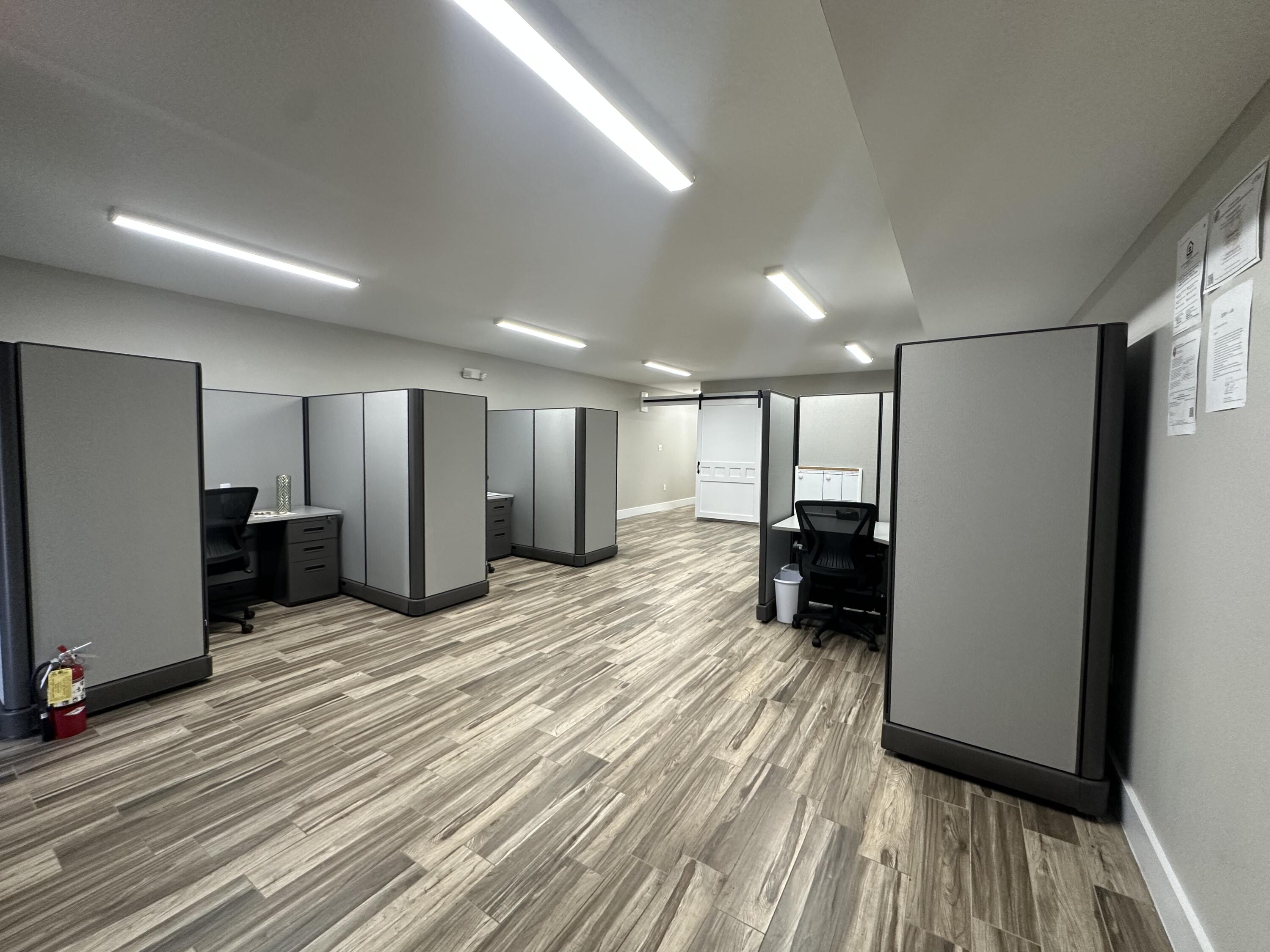 Versatile and well maintained office space featuring two open office areas, a private closed- door conference room, storage space, and a convenient half bath. The layout is ideal for collaborative work while still providing privacy for meetings or focused projects. Enjoy durable tile flooring throughout for easy maintenance, and take advantage of new cubicles available for tenant use- perfect for a quick, move in ready setup. This space is an excellent option for a business that requires functional office accommodations with minimal parking needs.