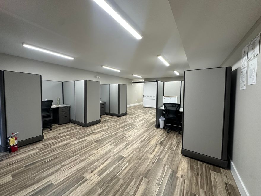 Versatile and well maintained office space featuring two open office areas, a private closed- door conference room, storage space, and a convenient half bath. The layout is ideal for collaborative work while still providing privacy for meetings or focused projects. Enjoy durable tile flooring throughout for easy maintenance, and take advantage of new cubicles available for tenant use- perfect for a quick, move in ready setup. This space is an excellent option for a business that requires functional office accommodations with minimal parking needs.