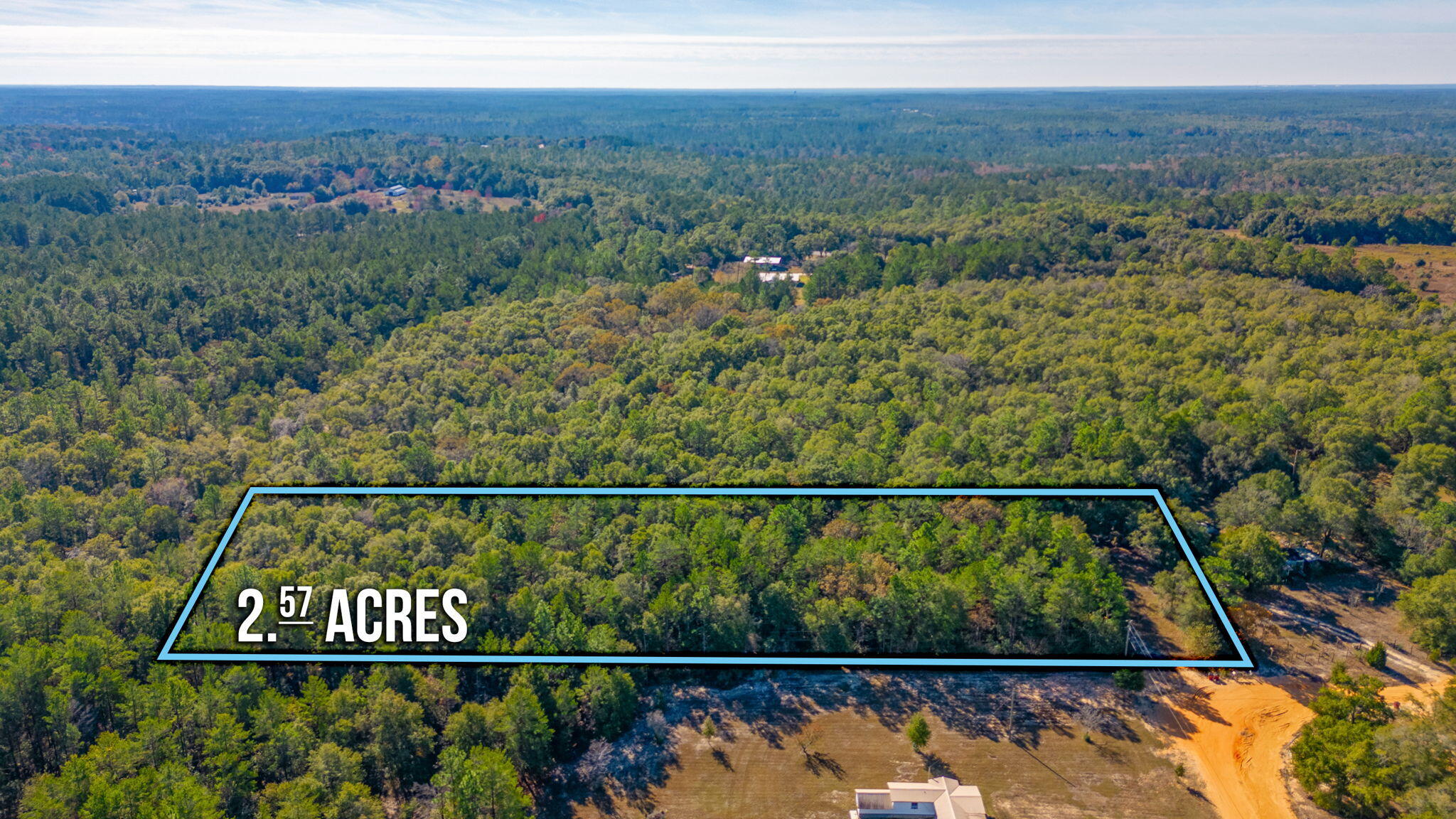 Nestled on 2.57 acres of lush, wooded landscape, this parcel boasts tranquility and privacy on a secluded dirt road. An updated survey ensures clarity for your plans. While utilities are not currently present, electricity is available at the street but a private well & septic will be needed. Embrace the freedom with no restrictions, welcoming manufactured homes to complement the picturesque surroundings. Experience the allure of country living without sacrificing convenience; a short drive unveils shopping and dining options. Accessibility is key, situated approximately 14 miles from the nearest hospital and less than 30 miles away from Eglin Air Force Base and the stunning shores of the Emerald Coast.Create your dream retreat, surrounded by nature's serenity, yet within reach of essential amenities and sought-after destinations. Don't miss this chance to craft your ideal haven amidst the beauty of this promising landscape. Discover the perfect balance between seclusion and accessibility in this prime real estate offering. (An additional 2.49 acres is also available for purchase.)