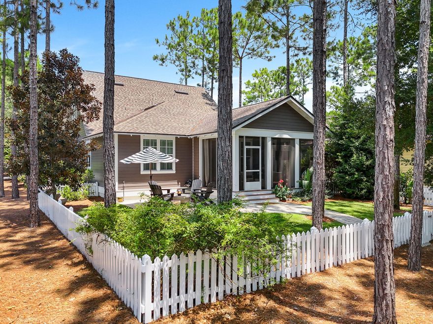 Nestled in the desirable Watersound Origins' Pathways section, this four bedroom, three and a half bathroom home offers privacy and convenience. Surrounded by mature landscaping and trails, it's steps from Village Commons' resort-style pool, fitness center, and sports courts, and just a 3-minute drive to Highway 98 for shopping and dining. Recent updates include new exterior paint, hardwood floors, quartz kitchen countertops, light green custom cabinetry, stainless steel appliances, and new carpet upstairs. The main level features an open-concept kitchen, dining, and family room, a spacious primary bedroom with an ensuite bath, a guest room with an ensuite, and a half bath.  Upstairs are two spacious bedrooms with a shared full bath with dual vanities and separate A/C control.