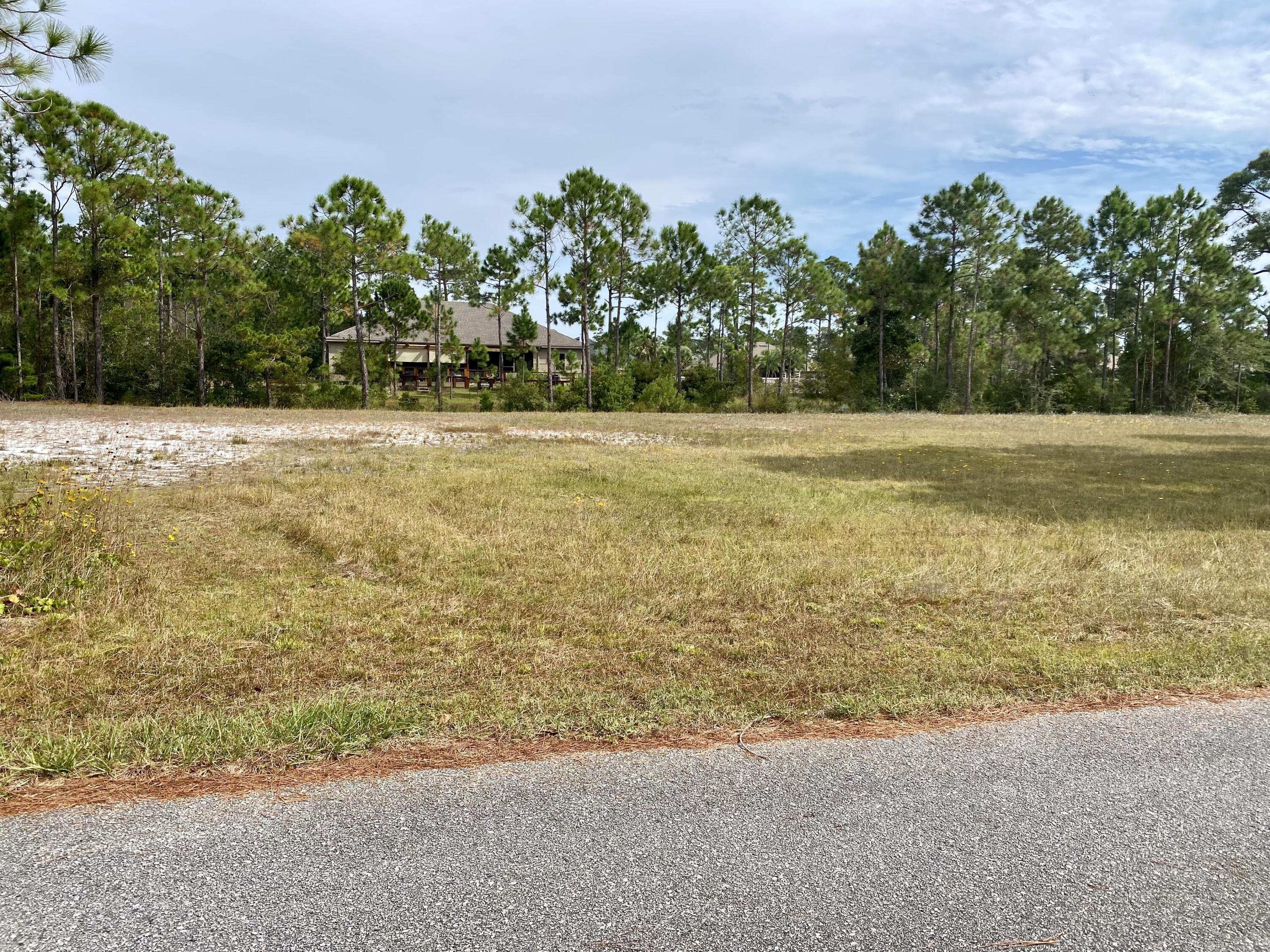 Back on the market by no fault of seller. Check out this beautiful, 0.36 acre lot located in the Smugglers Cove subdivision! Build your dream home on this spacious lot that borders one of the many ponds within the neighborhood.  Smugglers Cove offers owners several amenities including a community pool, clubhouse, tennis, and waterfront access with a dock, picnic area & boat launch.  The property is within 5 minutes of the Gulf Breeze Zoo, 10 minutes of the restaurants & shopping in Tiger Point, and 15 minutes of Navarre Beach.  Schedule your showing today!