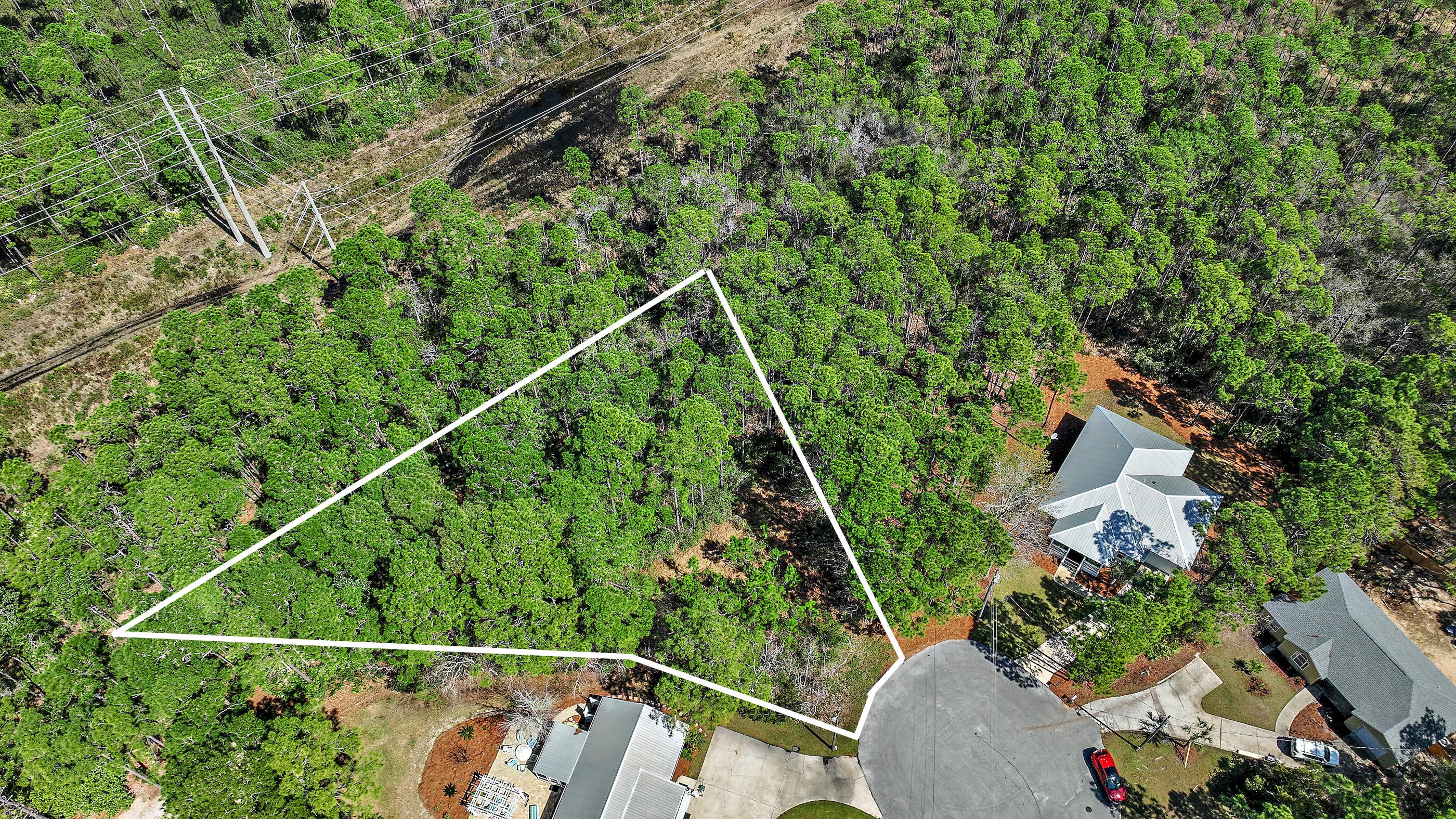 Build Your Dream Home in a Private Cul-de-Sac. Nestled in a quiet cul-de-sac, this .32-acre wooded lot offers the perfect canvas for your dream home. Tucked away for privacy yet conveniently located near Sacred Heart Hospital, Grand Boulevard, and Sandestin, you'll enjoy easy access to top dining, shopping, and entertainment.With its natural wooded setting, this lot provides an ideal backdrop for a custom-built home, offering both tranquility and convenience. Whether you're looking to build a peaceful retreat or an investment opportunity, Lot 13 presents endless possibilities. Geotech Report, Stormwater management plan, site plans, and building plans for a house that was previously approved by the county are available. Looking for more space? The neighboring lot (Lot 12) and an adjacent home are also available for purchase.