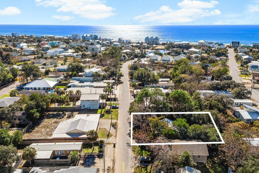 Tucked in the heart of Laguna Beach, this darling cottage embodies the quintessential beach lifestyle, just 1.5 blocks from the sugar-white sands and emerald waters of the gulf. Set on a generous 50x110 lot, this charming two-bedroom, two-bathroom retreat offers a perfect blend of vintage boho vibes and modern updates, making it an ideal second home or vacation rental.The home's inviting interior features fresh paint, updated flooring throughout and a newly renovated bathroom. A brand-new roof ensures peace of mind, and the property is being sold fully furnished, ready for you to start living the beach dream. Outside, a spacious backyard with a fire pit and seating area is perfect for evening gatherings under the stars. Laguna Beach's coveted location is a treasure trove for beach lovers, offering convenient access to the renowned Carousel Grocery Store, complete with a wine cellar and gift shop, and the iconic Thomas' Donut and Snack Shack. Enjoy easy golf cart or bike rides to the beach, or take a short drive to explore the vibrant dining and shopping options at Pier Park or along 30A. Free from HOA restrictions, this property provides the flexibility to embrace your personal vision of coastal living. Whether you're seeking a serene getaway or a savvy investment, this Laguna Beach gem offers an unparalleled opportunity to enjoy life at the beach.