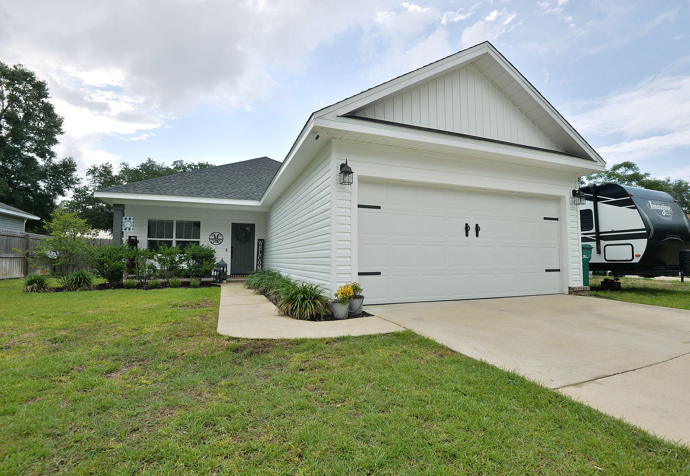 This home is a MUST SEE!! Parade of Homes Winner, with custom build features like 6'' baseboards, white shaker soft close cabinets and drawers, luxury vinyl plank throughout entire home, high impact glass windows, trey ceilings in practically every room in this home. Upgraded doors and windows give this home a touch of 30A feel and look! Quartz counter tops in the kitchen and all bathrooms certainly finish the beautiful decor of this truly one of a kind home. Outside of the home boasts a FULL 2 car garage, sprinkler system, privacy fence and PRIVATE inground pool. The Sellers also had Solar Panels installed and this home and is AMAZINGLY energy productive and efficient !Located a few blocks from the Marina and Docks as well as great shopping, dining and #1 rated schools in Florida!