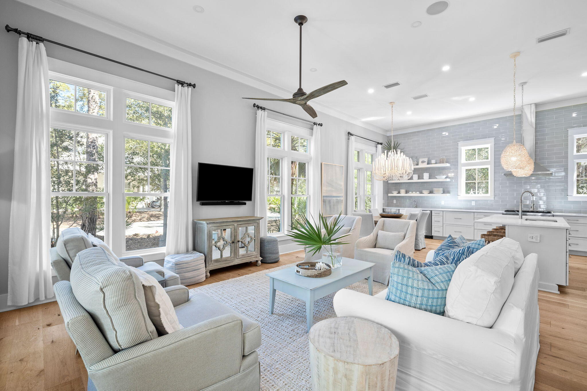 Nestled within the prestigious Hammocks of Seagrove gated community, this stunning 4-bedroom, 4.5-bathroom residence epitomizes coastal elegance, perfectly situated for the quintessential 30A lifestyle. From the inviting front porch with its charming swing to the convenient golf cart garage and ample storage for beach and biking gear, every detail of this home is crafted for comfort and ease. Just a half-mile from the nearest public beach access, this fully furnished home offers an ideal blend of secluded retreat and beachside living. Inside, the expansive open-concept living area is bathed in natural light, enhanced by soaring 12-foot ceilings, coastal chic furnishings, designer lighting and beautiful linen drapery. The kitchen is a standout feature, with a full wall of radiant soft grey  tile, clean white quartz island and extended counters providing additional space including a separate prep sink, stylish open shelving, a high-end gas range, stainless steel hood vent & refrigerator, wine refrigerator, and ice maker, ensuring culinary convenience. The home prioritizes comfort with a master suite on each level, featuring double vanities in every bathroom for a spa-like experience. The architectural excellence continues on the second floor, where 10-foot ceilings create an airy, elevated ambiance throughout the bedrooms and upstairs living areas. This meticulous attention to detail ensures every corner feels open and inviting, enhancing the home's serene and charming coastal cottage vibe. Additional features include a specially designed bunk room and a cozy 2nd living area upstairs. Outdoor living is highlighted by a screened porch off the kitchen for tranquil mornings and an outdoor sitting area for starlit evenings. An additional upstairs porch offers a private retreat off the master suite and living area. Residents enjoy access to two community pools, further enhancing the appeal of this exceptional property. With its blend of luxury, convenience, and coastal charm, this home provides a delightful retreat in a prime location near Seaside, WaterColor, and all the dining and shopping options of central 30A. Whether looking for a luxury primary or secondary home close to the beach or a lucrative vacation rental investment, or both, this home is definitely one you will want to see! Rental income potential and cost of ownership information is available.