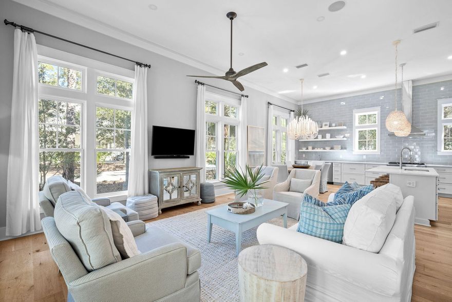 Nestled within the prestigious Hammocks of Seagrove gated community, this stunning 4-bedroom, 4.5-bathroom residence epitomizes coastal elegance, perfectly situated for the quintessential 30A lifestyle. From the inviting front porch with its charming swing to the convenient golf cart garage and ample storage for beach and biking gear, every detail of this home is crafted for comfort and ease. Just a half-mile from the nearest public beach access, this fully furnished home offers an ideal blend of secluded retreat and beachside living. Inside, the expansive open-concept living area is bathed in natural light, enhanced by soaring 12-foot ceilings, coastal chic furnishings, designer lighting and beautiful linen drapery. The kitchen is a standout feature, with a full wall of radiant soft grey  tile, clean white quartz island and extended counters providing additional space including a separate prep sink, stylish open shelving, a high-end gas range, stainless steel hood vent & refrigerator, wine refrigerator, and ice maker, ensuring culinary convenience. The home prioritizes comfort with a master suite on each level, featuring double vanities in every bathroom for a spa-like experience. The architectural excellence continues on the second floor, where 10-foot ceilings create an airy, elevated ambiance throughout the bedrooms and upstairs living areas. This meticulous attention to detail ensures every corner feels open and inviting, enhancing the home's serene and charming coastal cottage vibe. Additional features include a specially designed bunk room and a cozy 2nd living area upstairs. Outdoor living is highlighted by a screened porch off the kitchen for tranquil mornings and an outdoor sitting area for starlit evenings. An additional upstairs porch offers a private retreat off the master suite and living area. Residents enjoy access to two community pools, further enhancing the appeal of this exceptional property. With its blend of luxury, convenience, and coastal charm, this home provides a delightful retreat in a prime location near Seaside, WaterColor, and all the dining and shopping options of central 30A. Whether looking for a luxury primary or secondary home close to the beach or a lucrative vacation rental investment, or both, this home is definitely one you will want to see! Rental income potential and cost of ownership information is available.