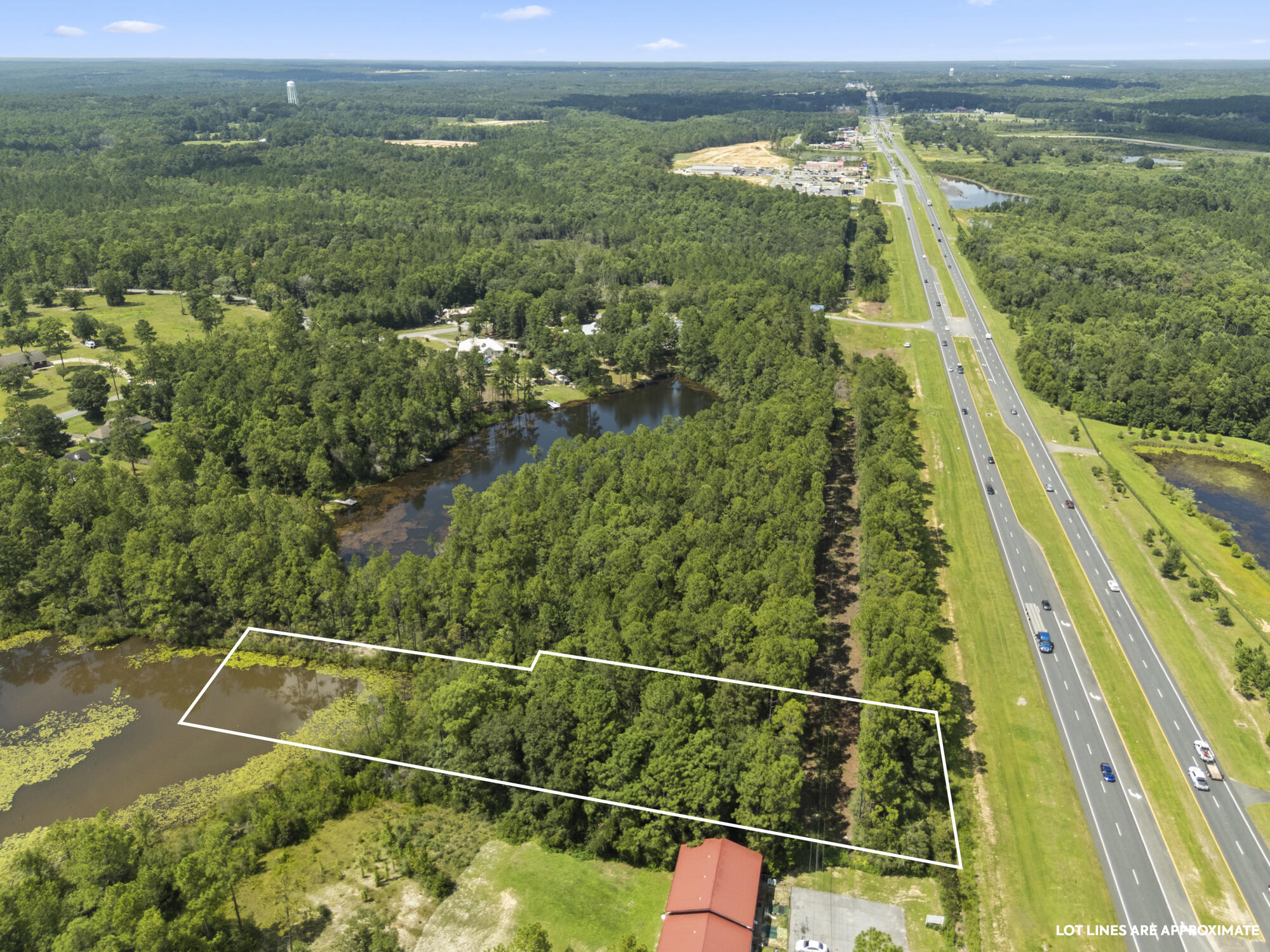 This 1.02 acre lakefront lot has 175 feet of US Hwy 331 frontage! Zoned/future use shows Estate Residential. Easy access to I-10 -just over 1 mile! Less than 2 miles to Lowes & Starbucks, approx 4 miles to downtown DeFuniak Springs, 13 miles to Publix in Freeport, and 25 miles to the beautiful white sandy beaches of the Emerald Coast! Enjoy the 225 feet of lakefront on this wooded lot that allows for privacy while still close to shopping, dining, and major highways and the interstate! This property also has great potential for future commercial development if annexed and amended to C-1!