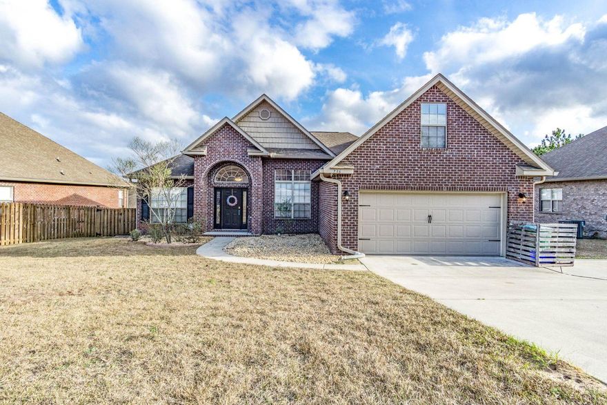 Lovely Large Brick 2543 sq ft Home Located on a Cul-de-sac South of I-10. 3 BR's PLUS an office, 2 full BA's, AND 500 sq. ft. Bonus Room which can be used as a 4th BR. Open Split Floor Plan which tastefully blends the best of Contemporary and Traditional Detail. You enter into a wide Foyer with Hard Wood Floors and a Paned Half Moon Window above the Door. There are Cathedral Ceilings in the Main living Area, Spacious Kitchen, Plenty of Cabinets, Breakfast Bar, Pantry, Laundry Room & Separate Dining Area. Main Living area is South-Facing and gets Natural Sun giving this Home a Bright and Warm Feeling. Large Master BR & BA, Garden Tub, Separate Shower and Toilet Room ALL BR's include walk-in closets! Outside features include Fenced in Back Yard, Sprinkler System, Deck & Parking for 8 Cars!