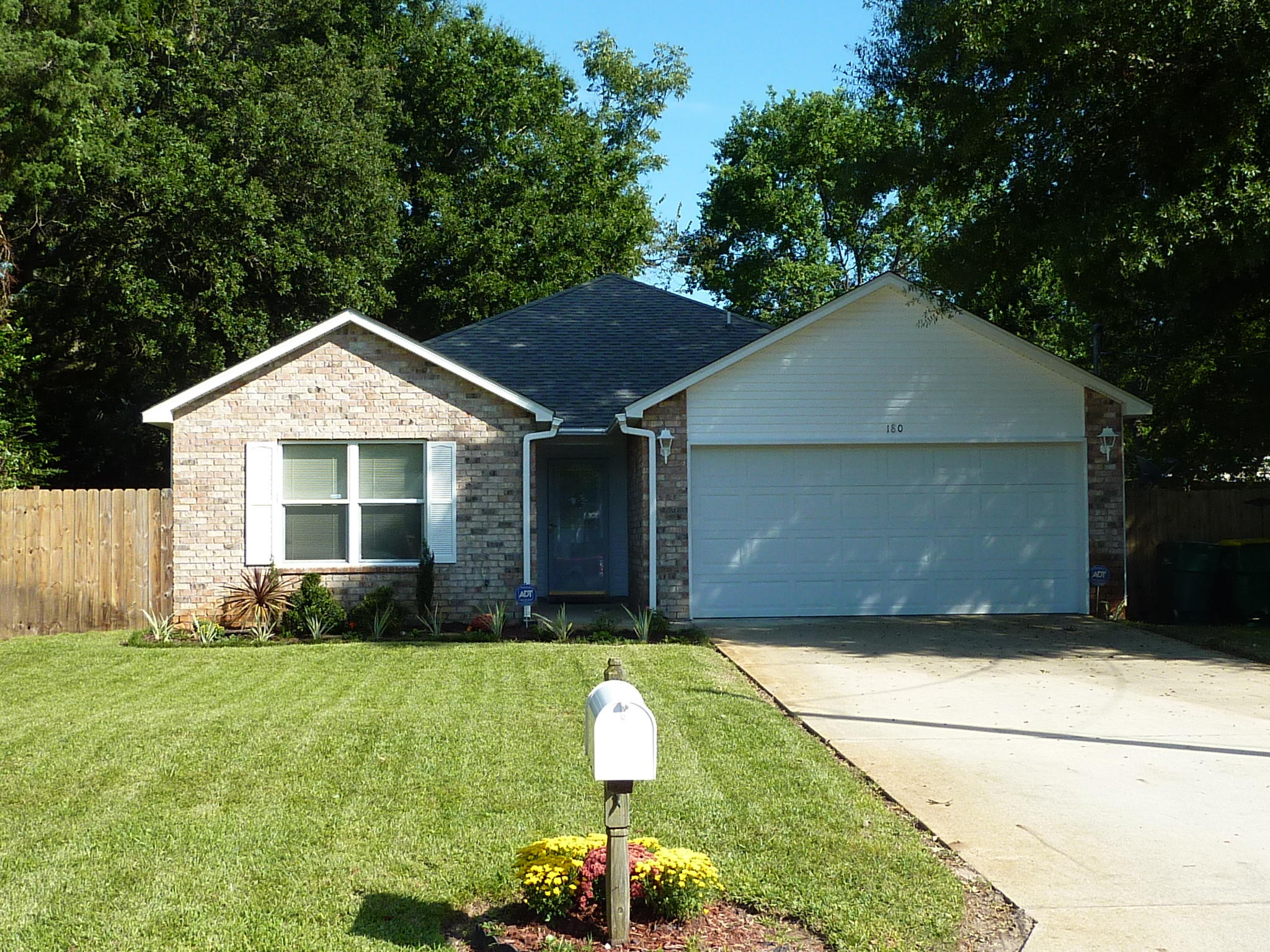 BEAUTIFUL HOME! LIKE NEW! LOTS OF EXTRAS ARE INCLUDED IN THIS PRETTY BRICK FRONT/VINYL SIDED HOME. CLASSY FRONT DOOR WITH GLASS INSERT. BEAUTIFUL TRAY CEILING IN LIVING ROOM. CERAMIC TILE FLOORS THROUGHOUT. CEILING FANS IN ALL BEDROOMS AND LIVING ROOM. BEAUTIFUL KITCHEN FOR YOU TO COOK IN, ELECTRIC STOVE HAS SELF CLEANING OVEN, BUILT-IN MICROWAVE, REFRIGERATOR, DISPOSAL AND DISHWASHER. ANGLED BREAKFAST BAR. SPACIOUS DINING ROOM. MASTER SUITE HAS LARGE WALK-IN CLOSET & BATH OFFERING DUAL VANITIES, TUB & SEPARATE SHOWER. COVERED BACK PORCH. TOTAL ELECTRIC GOOD CENTS HOME. COMPLETELY SODDED YARD HAS LAWN PUMP/SPRINKLER SYSTEM. PARTIALLY PRIVACY FENCED BACK YARD. 2-CAR GARAGE WITH AUTO OPENER!