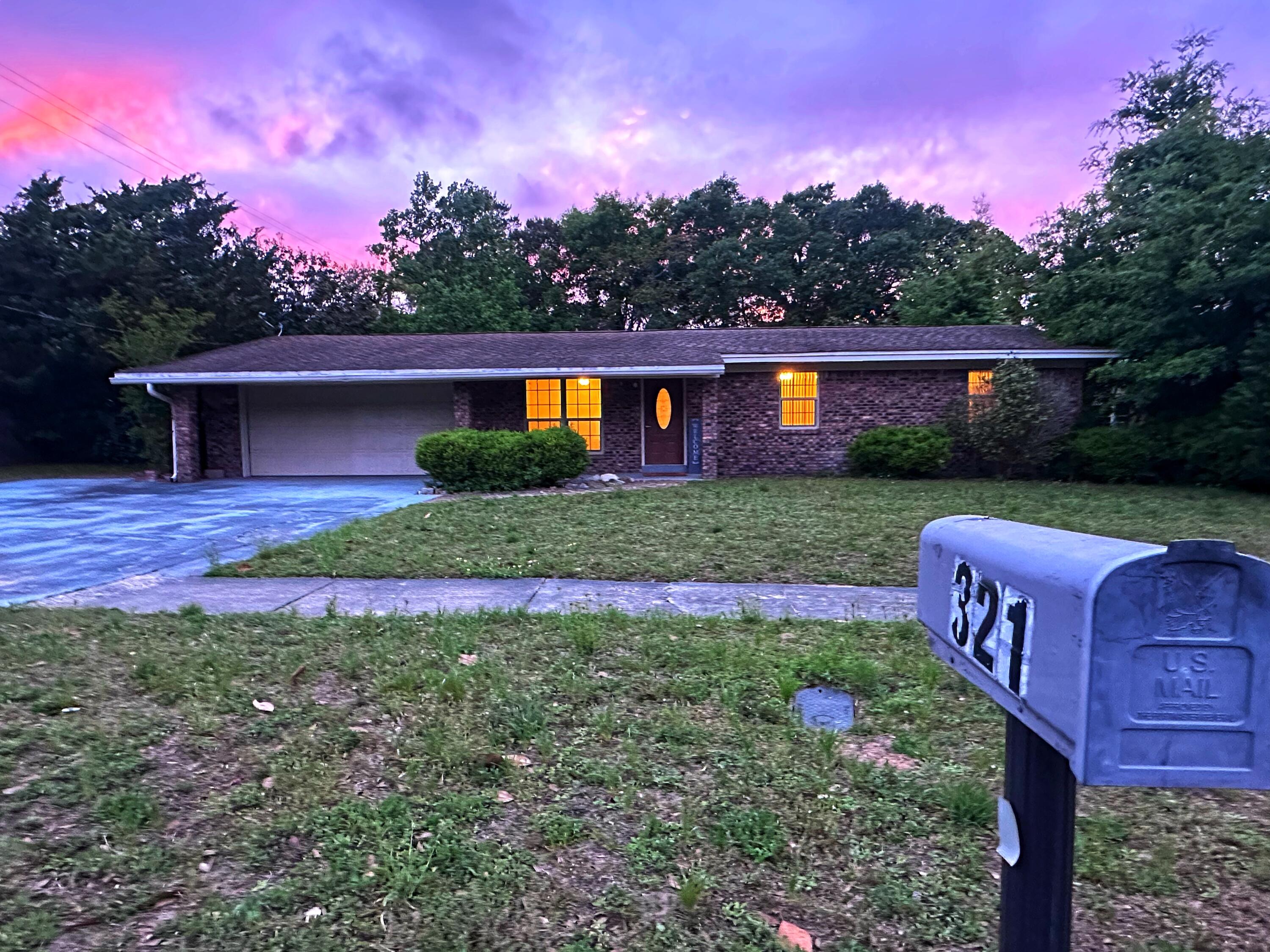 Welcome to this centrally located ranch-style home in Fort Walton Beach -- where natural light, a flexible layout, & the ultimate backyard escape come together.Inside, you'll find two spacious living areas & a centrally placed kitchen that makes everyday living and entertaining feel easy. The den or dining space features a stunning floor-to-ceiling gas fireplace feature wall & a sliding glass door that opens right onto the expansive backyard. The large, fenced yard offers storage options & plenty of space for parties, water games, or shade on a summer day. An extended driveway adds room for vehicles, a boat, or visiting guests. Bonus: No HOA--but there's a well-kept neighborhood park just steps away! New roof with accepted offer, move-in ready.