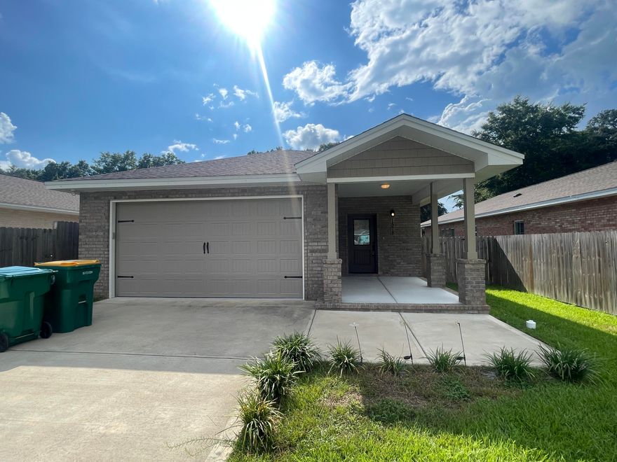 Step into this absolutely stunning 3-bedroom, 2-bathroom home, built in 2021! Enjoy the modern comforts of newer construction paired with an unbeatable location, just minutes from local military bases, within walking distance of the elementary school, and with quick access to the Mid-Bay Bridge for trips to the beach, shopping, dining, and entertainment.This home immediately impresses with its charming curb appeal, a welcoming covered front porch, and a spacious, privacy-fenced backyard complete with a covered patio--perfect for relaxing or entertaining. The two-car garage offers ample space for parking and storage.Inside, you'll find a bright and airy open floor plan with recessed lighting, contemporary finishes, and neutral colors throughout. The living area flows seamlessly into the formal dining space and the kitchen, which is outfitted with granite countertops, stainless steel appliances, a large island with a breakfast bar, plenty of cabinetry, and a convenient pantry.

The primary suite, tucked away at the back of the home for added privacy, is generously sized and features an en suite bathroom with dual vanities and a walk-in shower. Two additional bedrooms offer plenty of space and share a full guest bathroom.

Pets may be considered with prior owner approval and a non-refundable pet fee. No smoking permitted, including vaping.