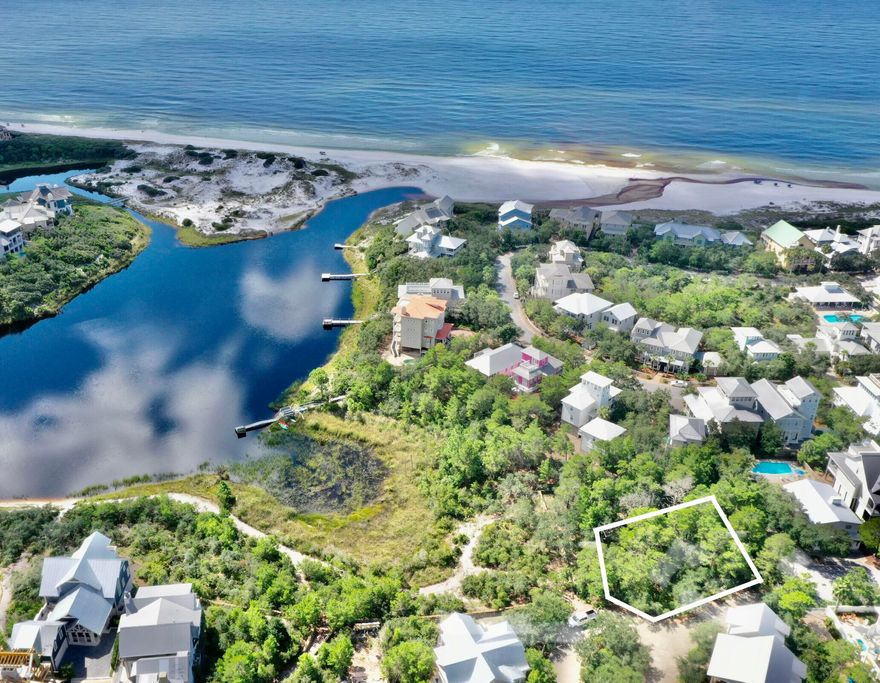 This beautiful lakefront lot in the highly regarded Draper Lake neighborhood south of 30A will offer both Gulf and lake views. Seller has started the design process with Archiscapes, and plans are available for review. Plans have not been approved by the ARB and can be modified before submitting to ARB.This site is located on the west peninsula of Draper Lake Coastal Village. The west peninsula boasts 5 green areas for common use, a community pool,  several  walking paths, a community boat dock and a 40-foot observation tower capturing panoramic views that include the emerald waters of the Gulf of Mexico.