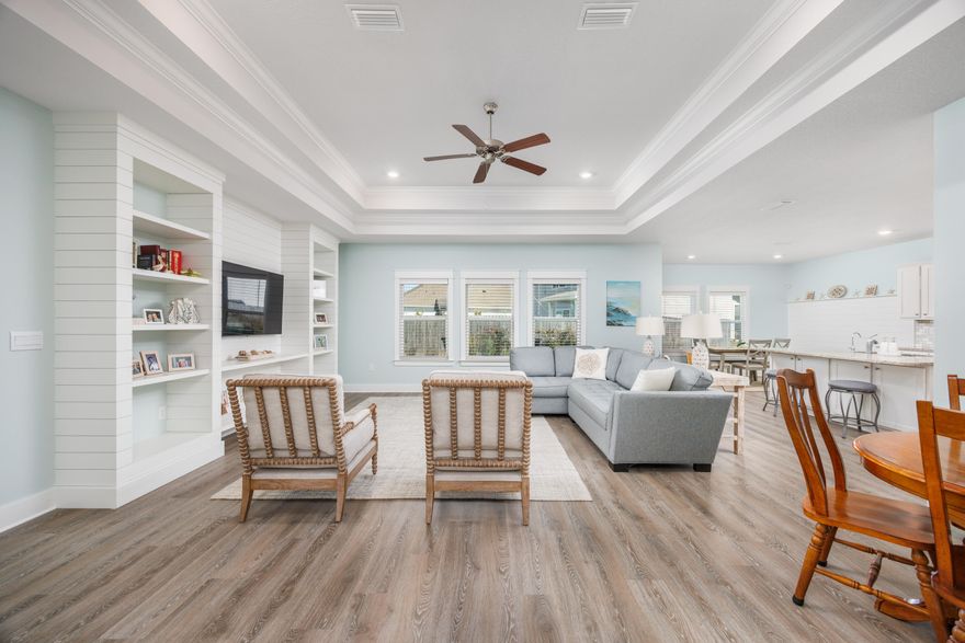 This 2022 Ashton Park home tells a different story than most new construction, situated on a spacious corner lot measuring approximately .28 acres and offering room that many newer properties simply do not. While many buyers move into a builder-grade home and then start budgeting for upgrades, this 4-bedroom, 2.5-bath residence already reflects approximately $25,400 in thoughtful improvements -- and the sellers are offering $8,000 toward buyer closing costs.From the moment you step inside, the difference is clear. Custom woodwork frames the entry. Craftsman-style trim and upgraded baseboards create depth throughout the living areas. A built-in entertainment center anchors the living room beneath a dramatic double tray ceiling with crown molding, adding height and architectural detail rarely found in standard inventory homes. Shiplap accents in the dining area and garage drop zone bring warmth and cohesion, while the upgraded backsplash and fresh interior paint complete a polished, move-in-ready feel.

The open layout flows naturally between kitchen, dining, and living spaces, supporting both daily routines and gatherings. A split-bedroom design provides privacy between the primary suite and secondary bedrooms, offering flexibility for guests, workspace, or hobbies.

Outside, the large premium corner lot provides usable outdoor space with professionally landscaped side and backyard areas, partial privacy fencing, gutters already installed, and room for a future pool. Less than half a mile away, the upcoming Ronnie Brannon Sr. Memorial Park Complex will feature a playground, dog park, pickleball courts, amphitheater, and multipurpose field, adding additional recreation options nearby.

Living in Freeport places you in a central Northwest Florida location with approximately a 30 to 45 minute commute to many key destinations. Beaches along South Walton, including Santa Rosa Beach and 30A, are easily accessible. Eglin Air Force Base, Hurlburt Field, the Army 7th Special Forces Group, the Naval School Explosive Ordnance Disposal, and Tyndall Air Force Base are all within a manageable drive. Northwest Florida Beaches International Airport, Pier Park, Grand Boulevard, Baytowne Wharf, Silver Sands Premium Outlets, Destin Commons, local schools, and everyday conveniences such as Publix are also within practical commuting distance, supporting both work and lifestyle needs.

HOA dues are $60 per month, homeowner's insurance averages approximately $1,600 annually, and the 2022 construction supports lower maintenance and modern systems. At $429,900, you are not purchasing a base-level home. You are stepping into a property where approximately $25,400 has already been invested in upgrades that enhance comfort, functionality, and long-term value -- without the added time, disruption, or additional expense after closing.

If you are comparing new construction in Freeport and want to understand how pricing, upgrades, and location work together to create measurable value, schedule your private showing today.