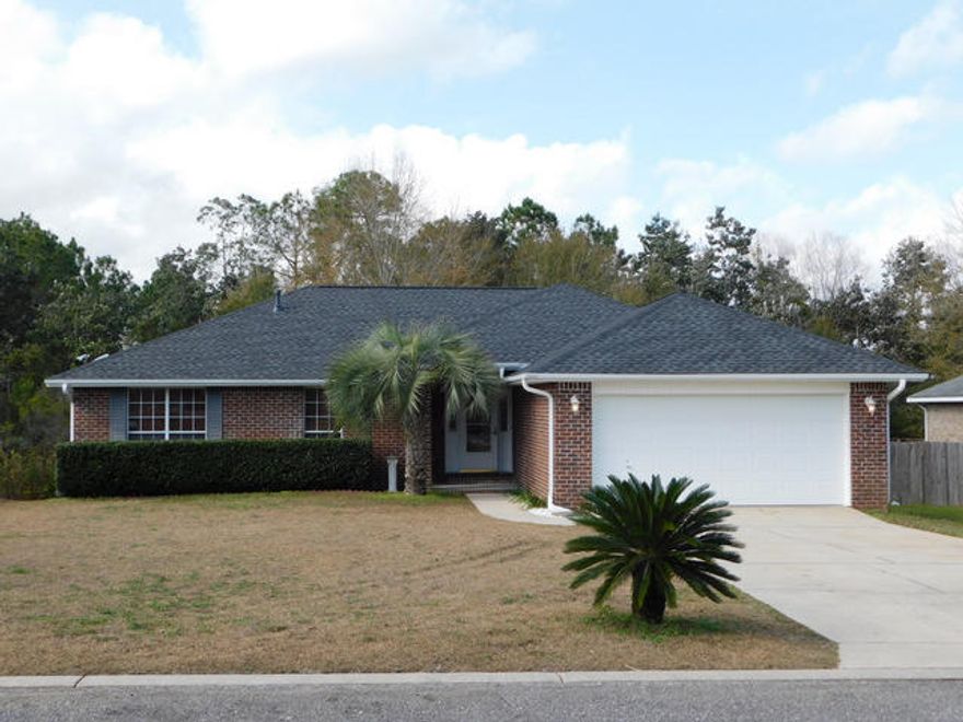 Beautiful 4 bedroom home with many recent upgrades/updates. There is a new gas HVAC heating system in 2017, New septic system and centipede sod installed in 2017, new 30 year High Def, dimensional roof installed in 2016. The interior of this home is carpet-free with 20 inch tiles and wood laminated floors through out. There are 4 bedrooms laid out in a split bedroom floor plan, vaulted ceilings and an open floor plan. This home is extremely clean and move in'' ready. Outside you will find a llrge deck out back that overlooks a Green space and is very private with plenty of shade. The large lot has much to offer. This is in a low traffic location and also has low county property taxes! Located on the very south side of Crestview, it makes the commute to the beaches and bases much quicker.