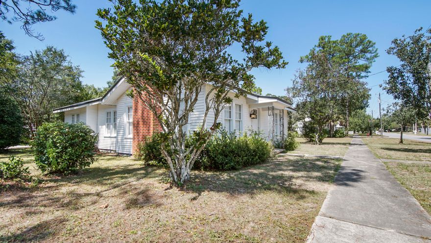 Move-in ready, in historic downtown DeFuniak Springs, blocks from Lake DeFuniak and across the street from Florence Park. The large, sunny rooms and hardwood floors welcome you into this inviting, renovated home with metal roof and new HVAC. The adjoining lot next door is available for purchase for an additional $50,000 (only available to buy as home/lot package - water and sewer tap paid - a $10k+ value). New paint, new appliances, updated kitchen and baths with newer windows - yet the charm remains with the original doors and hardware, real wood floors. The spacious dining room could be a 4th bed or flex space too. The screened porch/breezeway doubles as a comfy and cozy hangout space. Qualifying for all financing, don't miss your opportunity to own a downtown DeFuniak Springs cottage!