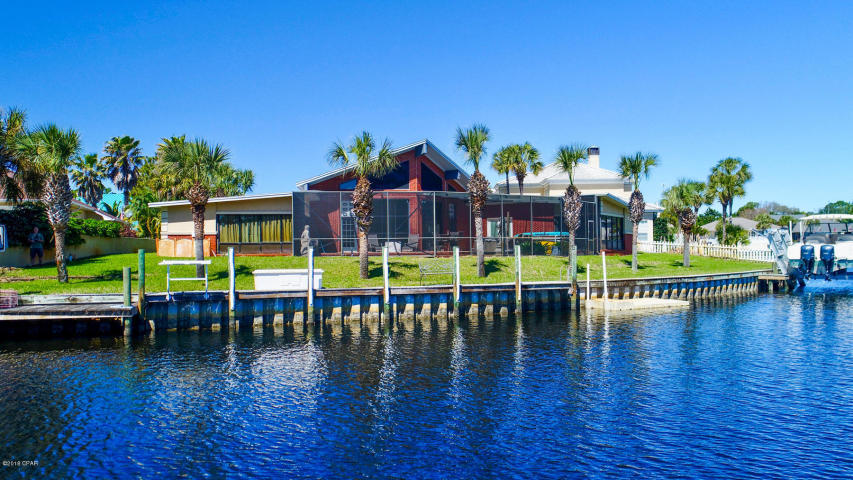 Awesome waterfront Bay Point home! I love this house for so many reasons! Amazing deep water frontage with 157 feet at the end of a canal with access to Gulf and not much boat traffic. New boat lift, screened in salt water pool and a hot tub with tiki bar. What fun for all everyone! This home has a wonderful open kitchen and living area that is bright and airy & looks out onto the pool & the canal. All the bedrooms have there own recently updated bathroom. This split bedroom floor plan gives the master plenty of privacy & its own wing.The master bedroom is huge.With plenty of room for a sitting area, office or workout area.This home has a lot of character & love. A home this special, and in the sought after community of Bay Point will not be on the market for long. A definite must see!