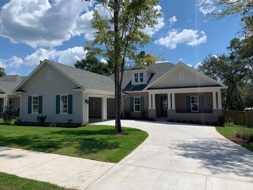 Gorgeous, one story home in Niceville's newest subdivision Deer Moss Creek! This 4 bedroom, 3 bath beauty will have a mix of wood flooring, tile and carpet. Quality construction includes impact resistant windows, insulated doors, brick and Hardie board siding and more. Deer Moss Creek is a mixed-use community including single family homes, commercial properties, a village town center and light industrial. Phase 1 in DMC, Hartfield, features 98 single-family lots ranging from .11-.38 acres. A paved trail system is planned to run along the path of the creek. The center of Phase 1 boasts a park and gazebo as well. Plenty of lovely trees, sidewalks and future plans include a community pool, community center, more parks, a bike path and more.