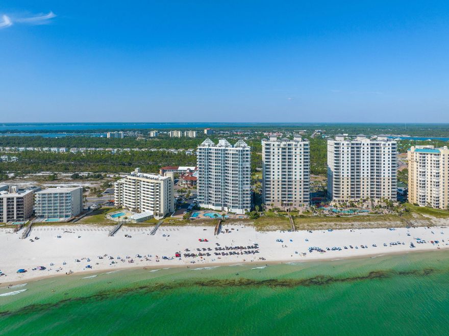 Experience the ultimate in beachfront living with this stunning Gulf-front 3-bedroom, 2-bath condo at Palacio in Perdido Key. This fully furnished retreat invites you to embrace the beach lifestyle, offering endless opportunities for relaxation and rental income. From the moment you step inside, you'll notice the thoughtful design and coastal charm. With NO CARPET, the condo features sleek tile and luxury vinyl flooring, enhancing the breezy ambiance while keeping sandy footprints to a minimum. The spacious living room, adorned with tasteful coastal decor, is perfect for hosting guests. Natural sunlight is ever abundant, highlighting the breathtaking views of turquoise waters just beyond your balcony. The three expansive bedrooms offer comfort and tranquility, making this condo feel like