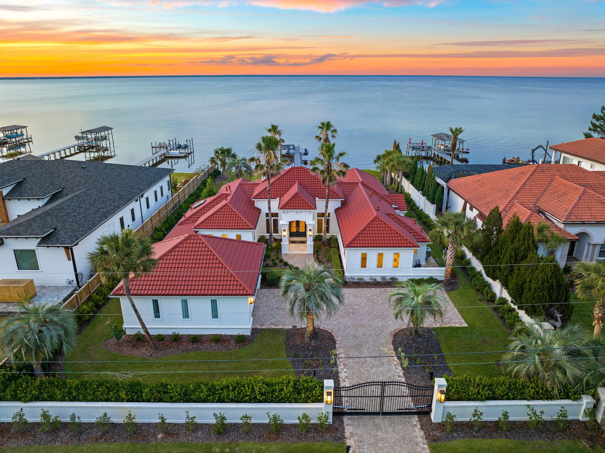 Exemplary positioning along the beautiful Choctawhatchee Bay juxtaposed gated privacy and manicured grounds characterizes this striking waterfront retreat primely located in the heart of Miramar Beach in Walton County, Florida. Notably remodeled, this exceptional home features a brand new roof (2022) as well as an updated interior & exterior palette yielding a sophisticated coastal design by Mary Ezell and executed by the talented team at Magnolia Custom Homes.