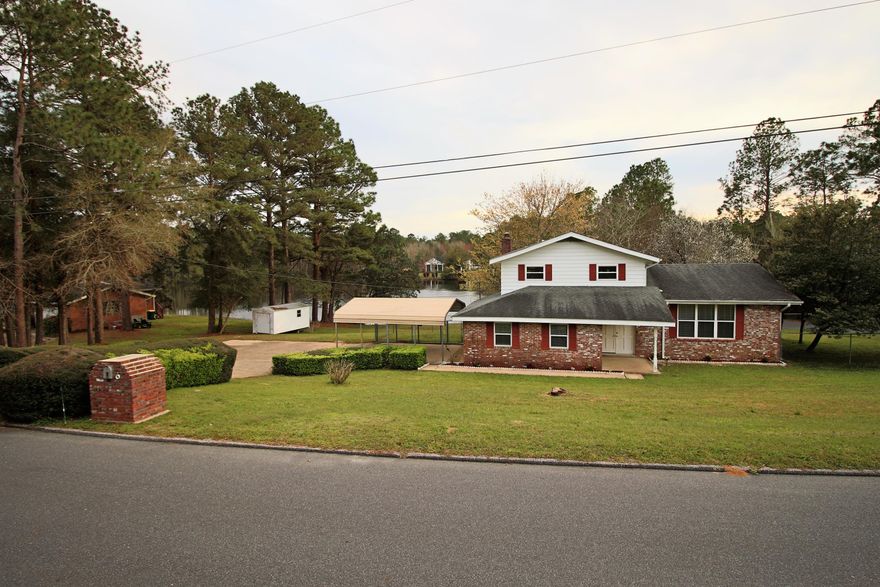 Seller will pay up to $4,000 Closing Cost with acceptable offer. Lake Front Property! Way Under Market Value. Major Price Reduction. Deal of the year. Enjoy the private (stocked) lake with 140 Ft. of lake frontage. Access to 3 lakes total. The Lot has been approved to have a private dock installed. Lake views from the kitchen, dining area, and living room allow for romantic nights by the wood burning fireplace. From the time you rise in the morning to the time you lay down to rest, the lake view from your master bedroom will put you in a relaxed state-of-mind. AND...the over-size deck allows for endless cook outs. Fish and play games all while overlooking the lake. Home Warranty include.