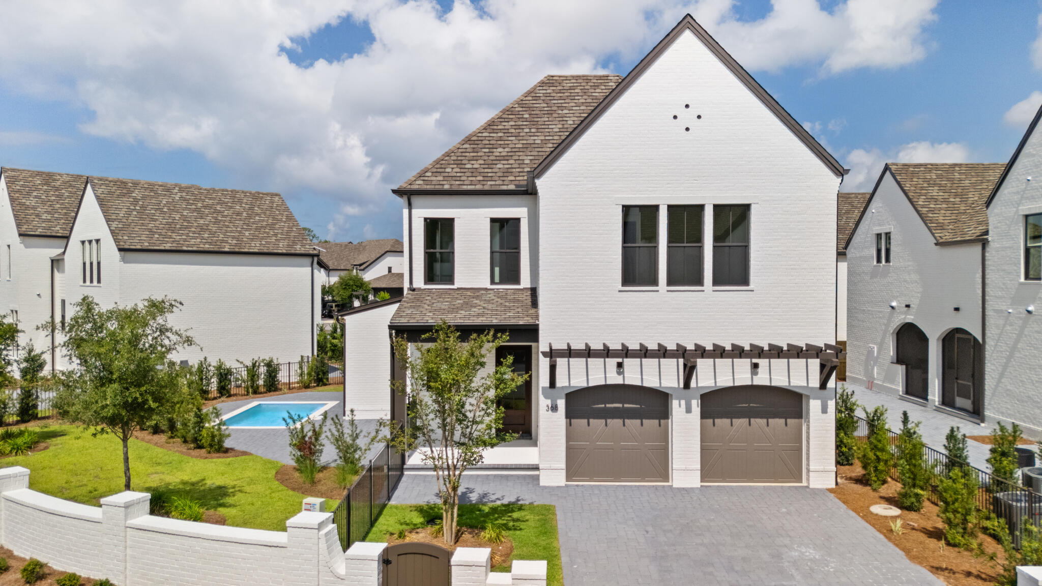 The Last new construction home in RidgeWalk! Welcome to the epitome of luxury living in the exclusive RidgeWalk community, just moments away from the pristine beaches of 30A. Nestled within a gated, non-rental enclave, this exquisite Normandy floor plan offers a lifestyle of sophistication and comfort.Step into the inviting living room, where a sleek linear fireplace takes center stage, flanked by two doors leading to the outdoor porch. Entertain with ease as you grill up delights on the built-in grill, or take a refreshing dip in the private pool, creating cherished memories with loved ones against a backdrop of serene surroundings. The heart of the home, the kitchen, is a culinary masterpiece. Woodharbor cabinets stretch to the ceiling, providing ample storage space, while upgraded Cambria countertops offer both elegance and functionality. Fulgor Milano appliances elevate your cooking experience, and a stunning marble backsplash adds a touch of glamour. Adjacent to the kitchen, a working pantry and drop zone lead seamlessly to the two-car garage, ensuring convenience in your day-to-day activities.
Ascend the elevator to the second floor and discover the lavish primary suite, a sanctuary of comfort and style. Vaulted ceiling adorned with cedar beam and ship lap create an atmosphere of tranquility, while a custom-designed closet by Tailored Living offers organization and sophistication. Indulge in the spa-like bath, featuring a crushed stone tub accented by a gorgeous fluted 3D honed tile feature wall, promising moments of relaxation and rejuvenation.
Two additional guest bedrooms, connected by a convenient Jack and Jill bath, provide comfortable accommodations for family and friends. A well-appointed wet bar adds a touch of luxury, perfect for entertaining guests or enjoying a nightcap before retiring for the evening.
Experience the pinnacle of coastal living in this exceptional Normandy floor plan, where every detail has been thoughtfully curated to exceed your expectations. Don't miss your opportunity to call this exquisite residence home. Schedule your private tour today and embrace the lifestyle you deserve in RidgeWalk.