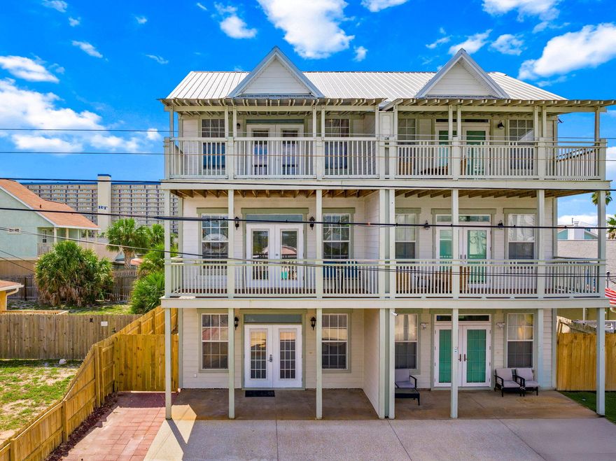Immaculate 4-bedroom, 5-bath coastal home is just two blocks--less than a 5-minute walk--to the Gulf of America. Thoughtfully updated and fully furnished, it's completely rental-ready or ideal as a full-time residence. Every bedroom offers a private en suite bath, and multiple balconies on all three levels provide plenty of space to relax and enjoy the coastal breeze. Inside, the open-concept living area features French doors leading to a balcony, while the kitchen boasts granite countertops, stainless steel appliances, and stylish finishes throughout. Recent upgrades include a 2022 metal roof, 2024 HVAC, new interior paint (2025), and new flooring on the stairs, second, and third floors (2025). Step outside to your own private backyard oasiscomplete with outdoor shower and space that feels like your own beach retreat. Located within golf-cart distance to restaurants, shopping, boat launches, and St. Andrews State Park, this home offers the perfect blend of comfort, convenience, and coastal charm. Ideal as a primary residence, second home, or short-term rental investment.