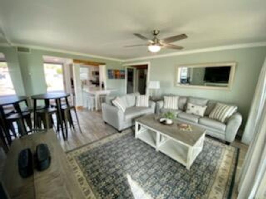 Completely renovated and move in ready condo on the first floor of Sandpiper Cove. This one bedroom and one bath plus a bunk room condominium has many new upgrades including all new appliances, new impact resistant windows and doors, new flooring, new updated bath. Beautifully decorated with new furniture!   Unit has rear and side covered porches, which add extra light.   Also, there is an engineered and approved plan to extend the rear deck four feet which could add to your living space!