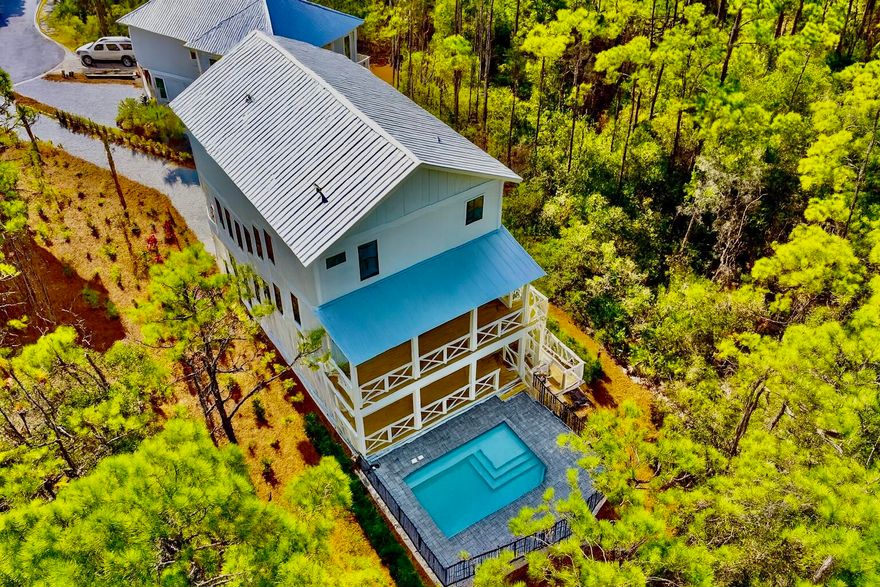 Brand new - 5 bedroom, 5.5 bath house in gated Treetops neighborhood adjacent to Seacrest with excellent rental projections ($150,000+) and deeded beach access just half a mile away. (Free golf cart beach shuttle picks up 50 yards from house) Enjoy a coastal chic, open concept design perfect for entertaining. The main floor (second floor) includes the living room, dining room, kitchen and laundry room. The first floor includes a two-car garage, entry way and two guest suites with private bathrooms. The third floor includes the spacious master suite with a luxurious master bathroom and a huge closet. The third floor also hosts two additional guest suites with private bathrooms. Treetops offers direct access to both 30A and Hwy 98 with easy access to Rosemary, Seacrest and Alys Beach.