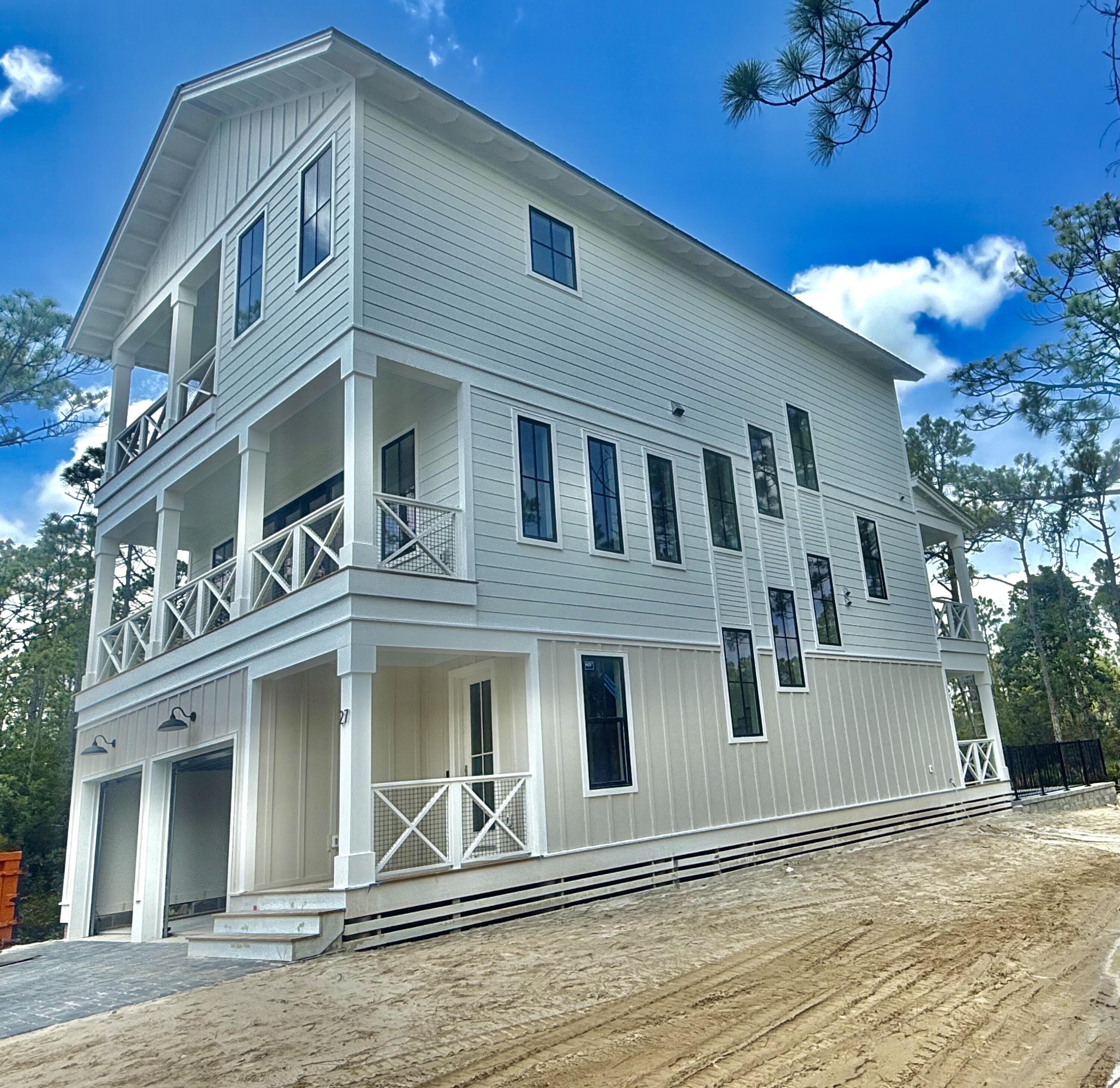 Brand new 5 bedroom, 5.5 bath house in gated Treetops neighborhood adjacent to Seacrest with excellent rental projections ($150,000+) and deeded beach access just half a mile away. New construction to be completed by late June. Enjoy a coastal chic, open concept design perfect for entertaining. The main floor (second floor) includes the living room, dining room, kitchen and laundry room. The first floor includes a two-car garage, entry way and two guest suites with private bathrooms. The third floor includes the spacious master suite with a luxurious master bathroom and a huge closet. The third floor also hosts two additional guest suites with private bathrooms. Treetops offers direct access to both 30A and Hwy 98 with easy access to Rosemary, Seacrest and Alys Beach.