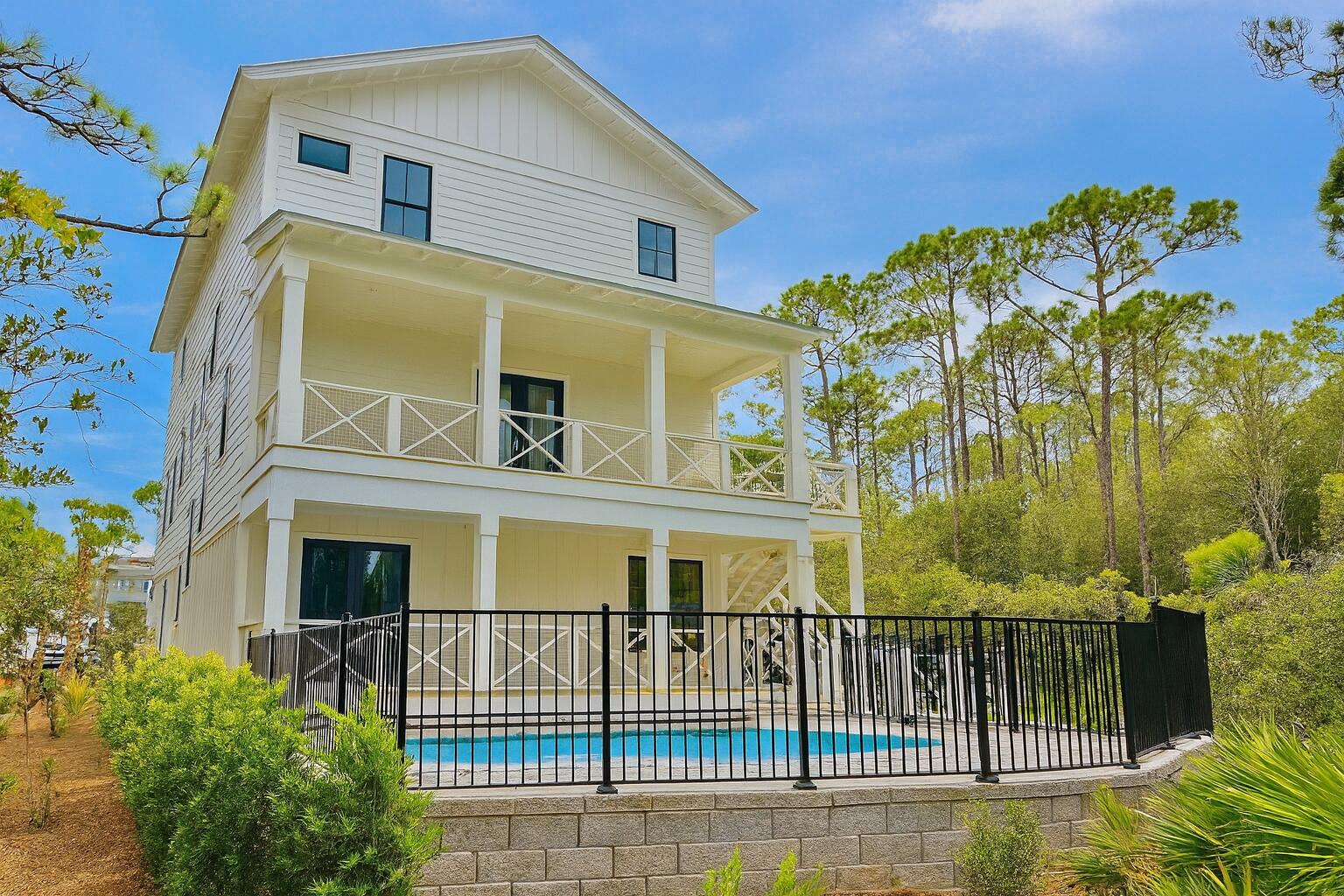 Brand new - 5 bedroom, 5.5 bath house in gated Treetops neighborhood adjacent to Seacrest with excellent rental projections ($150,000+) and deeded beach access just half a mile away. (Free golf cart beach shuttle picks up 50 yards from house) Enjoy a coastal chic, open concept design perfect for entertaining. The main floor (second floor) includes the living room, dining room, kitchen and laundry room. The first floor includes a two-car garage, entry way and two guest suites with private bathrooms. The third floor includes the spacious master suite with a luxurious master bathroom and a huge closet. The third floor also hosts two additional guest suites with private bathrooms. Treetops offers direct access to both 30A and Hwy 98 with easy access to Rosemary, Seacrest and Alys Beach.