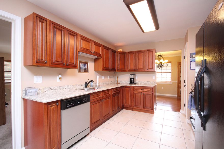 Home for sale in Niceville, FL. This brick ranch is in the heart of Niceville and has been completely updated and remodeled. Step inside the front door and you will appreciate the tile floors, vaulted ceiling and fireplace. To the right is a formal dining room, eat in kitchen, large BONUS room and large laundry/storage room. To the left are the bedrooms and bathrooms. Features include granite counters, oil rubbed bronze fixtures, new cabinets/vanities, pantry and black/stainless appliances. Don't miss the crown molding, baseboards, 6 panel doors and french door to the fenced in backyard. The large yard can easily accommodate a pool or large swing set. There are 2 storage buildings one in the back and one on the side. FREE one year home warranty. Don't pay rent - it's time to buy!