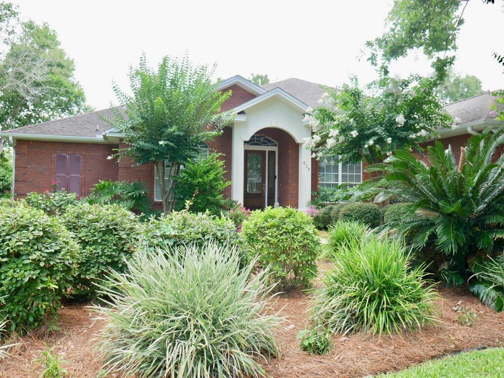 Swift Creek home with a NEW ROOF is ready for you! Located in the heart of Niceville, the community of Swift Creek offers a resort style pool with a gorgeous club house, tennis courts, basketball court, a children's park, a nature trail and a picturesque lake. The open floorplan of this home offers plenty of room for a growing family or for guests to visit! When you enter through the wide foyer, you will notice the raised ceilings, crown molding and deep baseboards. The dining room accented with hardwood floors and graceful columns is to the right and the living room with glass doors to the large covered back patio is directly ahead. Just off of the living room is the kitchen that is open to the family room. The kitchen is outfitted with hardwood floors, granite counters, tile back splash
