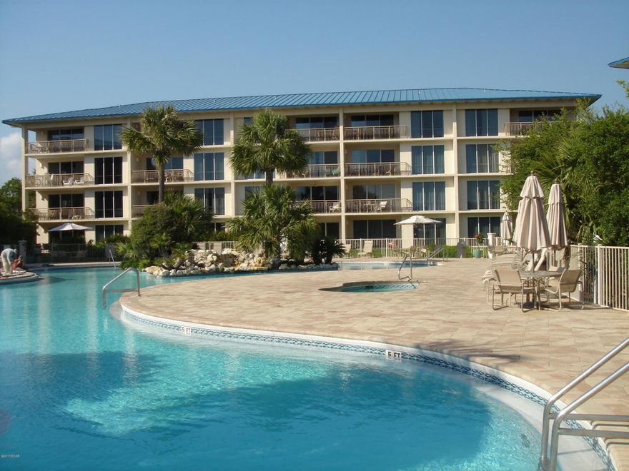 Enjoy Gulf Views from Kitchen, living Room and Master Bedroom. Good rental history available upon request. Fresh paint and new carpet in bedrooms. Tile in kitchen, living room and baths. Community includes a Lagoon style pool with Waterfall and hot tub, Tennis courts, Shuffleboard, Children`s Playground as well as Crabby Steve`s Bar and Grill Gulfside. There is no need to leave the complex! Age, SF and Room Sizes are approximate. Please verify if important.