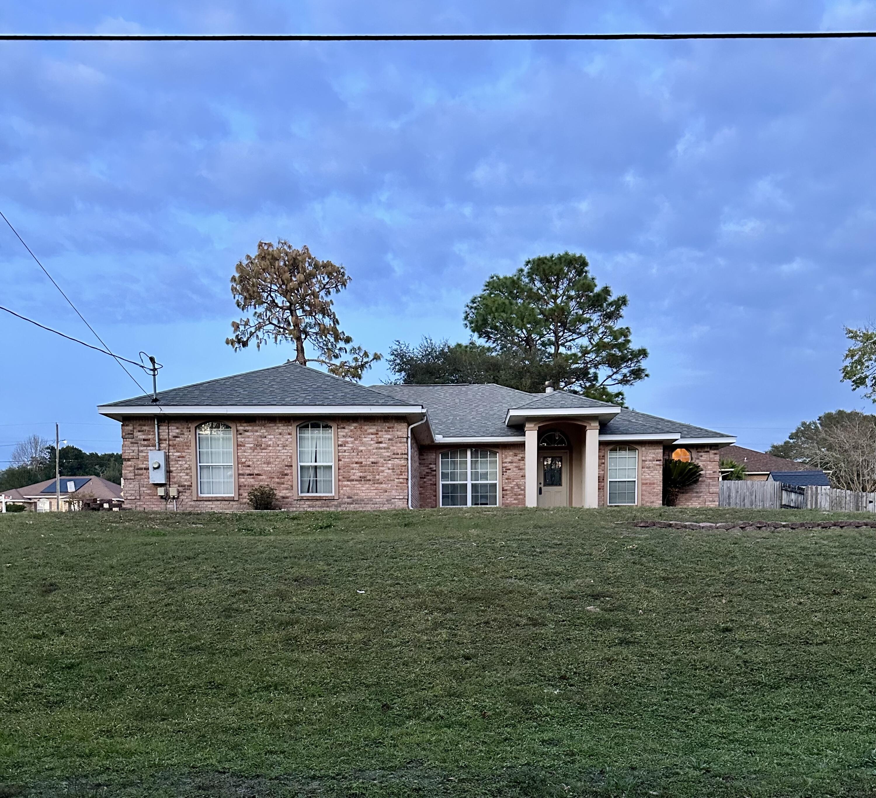 Welcome to this lovely brick home.  Located on a corner lot on the south side of Crestview.  This 3 bedroom, 2 bath, home includes a nice corner fireplace making the cold evenings cozy.  This home has a formal dining room and a roomy breakfast room.  There is a covered patio off the great room which is a wonderful bonus providing you with an outdoor  entertaining area or for simply relaxing.