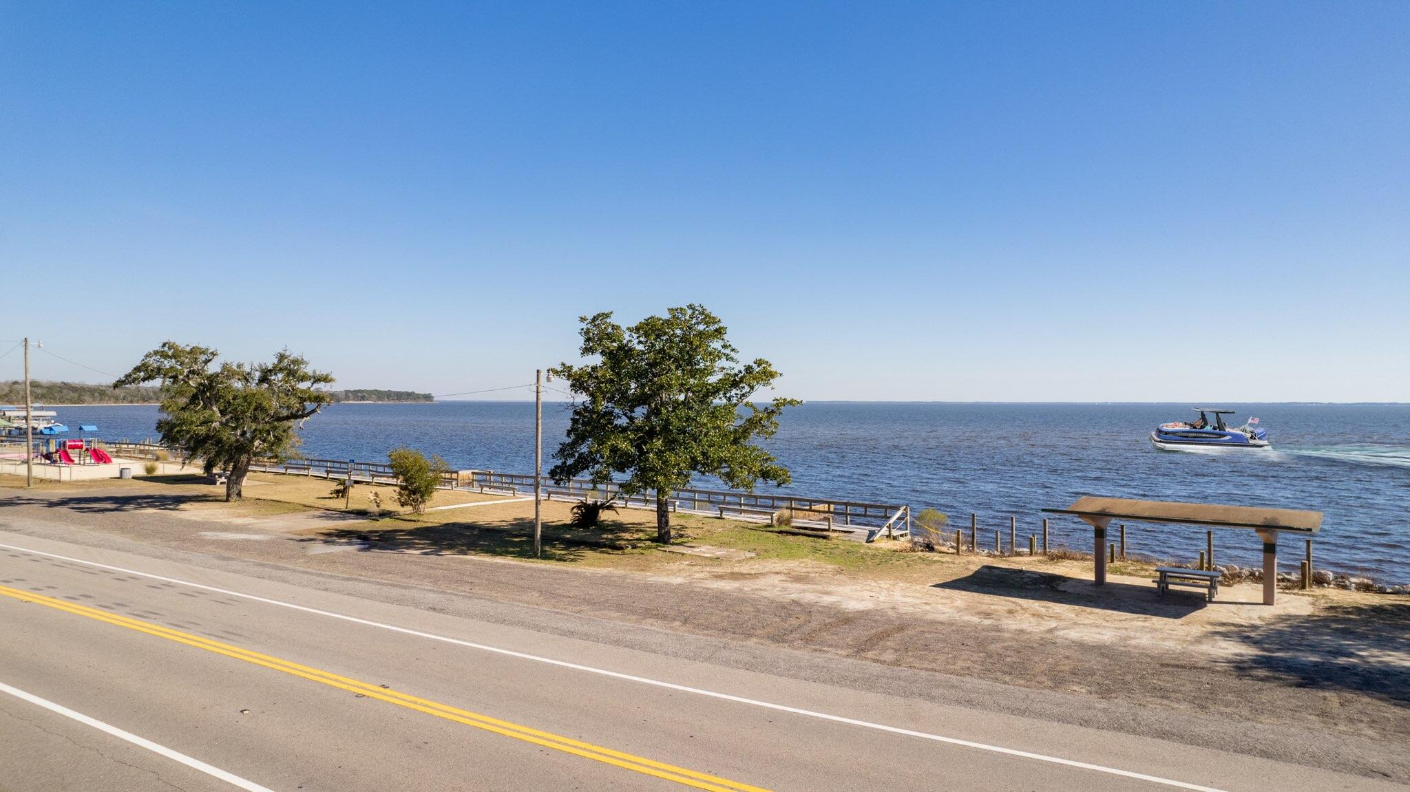Incredible opportunity built on a beautiful Bay view Lot!! Existing NFWMD and DEP permits. Choctawhatchee bay Views at a modest price. Located just north of and on Highway 20 across from the boat Launch where you will be able to have your boat in the water in just a few of minutes. Click on the photos to discover the type of views you will enjoy daily. So ...don't delay and don't let this opportunity slip away!