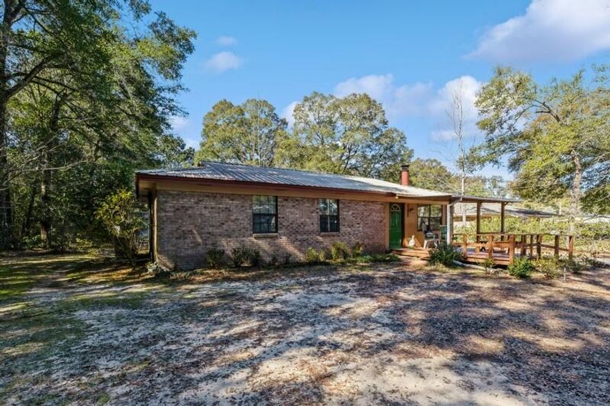 Welcome to your dream home! This charming 4-bedroom, 1-bathroom gem is strategically located near military bases, shopping centers, dining hotspots, and the growing downtown. Experience the perfect blend of comfort and convenience in this adorable residence. Step inside to discover a cozy living room adorned with a wood-burning stove featuring triple stainless-steel stock. Feel the warmth radiate throughout as you enjoy the intimate ambiance, creating the perfect space for family gatherings and relaxation. The living room is the heart of this home, offering both comfort and charm. The home boasts a metal roof, ensuring durability and longevity. Picture yourself unwinding on the 8x12 lovely front porch, where you can soak in the serene surroundings and enjoy your morning coffee or evening sunset. Situated on a generous lot adorned with beautiful hardwoods, this property provides ample outdoor space for your enjoyment. Embrace sustainability with a rainwater barrel, contributing to both environmental consciousness and a lush garden. For the hobbyist or DIY enthusiast, the property features a 9x17 shed/workshop, providing the perfect space for your projects. Additionally, a 9x7 firewood shed ensures you'll stay warm and cozy during the colder months. Other features are a walk-in shower, providing convenience and style. Stay comfortable year-round with the new AC ductwork and the addition of 2 new vents, ensuring optimal climate control throughout the home.
This home is not just a residence; it's a haven of comfort & functionality.  Don't miss the opportunity to make it yours and enjoy the perfect blend of sensible amenities and timeless charm. Contact us today to schedule a viewing and experience the rustic charm of this delightful property!