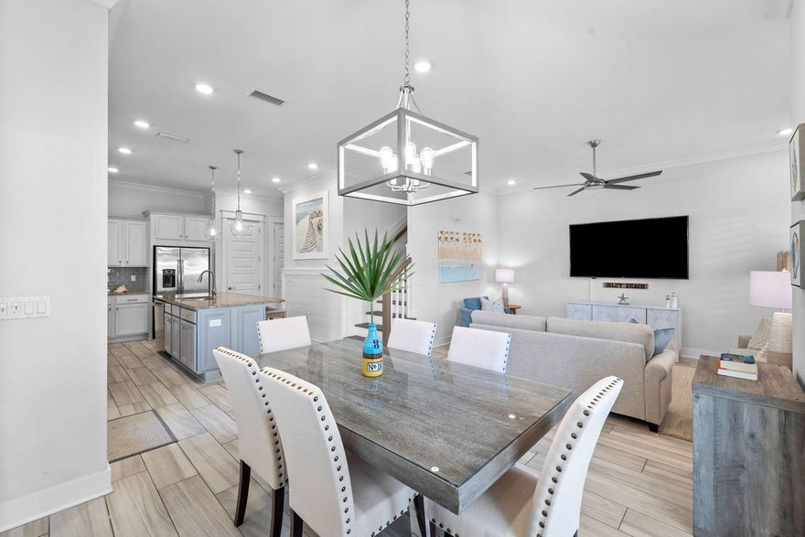 Experience ultimate privacy in this exquisite three-bedroom townhome in the sought-after Prominence community. Recently updated with all new first-floor furnishings, this unit is nestled amidst serene wooded areas and Deer Lake State Park, offering unparalleled seclusion. Situated on a cul-de-sac, this unit provides the best of both worlds - proximity to The Big Chill (formerly The Hub) and a tranquil retreat. Upon entering, you'll be captivated by the spacious open concept layout with 10' ceilings and an abundance of natural light streaming in from the west and north-facing windows. The kitchen, living, and dining areas seamlessly blend together, providing ample space for family and guests. Step out onto the outdoor deck overlooking the wooded area, perfect for enjoying your morning coffee or unwinding with an afternoon cocktail. The kitchen boasts granite countertops, stainless steel appliances, and a stylish glass subway tile backsplash.

The first level also features a convenient laundry room, a half bath, and a large two-car garage with a custom-built closet for storing all your beach essentials.

Ascend the shiplap-accented stairway to the primary bedroom, where floor-to-ceiling windows offer breathtaking views of the community wooded area. The luxurious ensuite showcases dual vanities and a beautifully tiled shower.

Two additional bedrooms await on the second floor - one with a king bed and the other designed as a charming bunk room. Complete with shiplap walls, a built-in twin over twin bunk bed, and a twin trundle bed, this room is perfect for the younger members of your group.

Prominence offers an array of activities for guests of all ages. Enjoy the well-appointed fitness center, take a dip in the expansive 5,000 square foot community pool, or explore The Big Chill, featuring shops, restaurants, and a central green space for the kids to play while you catch the big games on the Jumbotron.

This fully furnished 30A townhome offers unmatched seclusion and the convenience of being close to 30A and The Big Chill. Whether you're seeking the perfect beach home or a lucrative rental investment property, this is an opportunity not to be missed. 