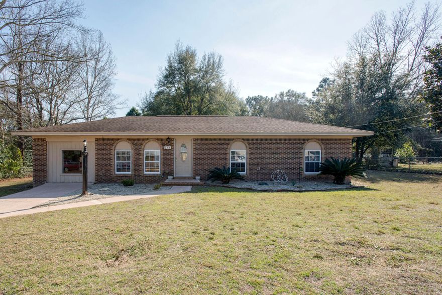 Fantastic 3 bedroom 1 bathroom brick home just waiting for its new owner. The converted garage can be used as a second living space or as a bedroom if needed.  Perfect home for first time home buyers who are looking for a place to make their own and has TONS of extra outdoor space - the lot is almost half and acre that is completely fenced in and has a large storage shed with attic storage space.