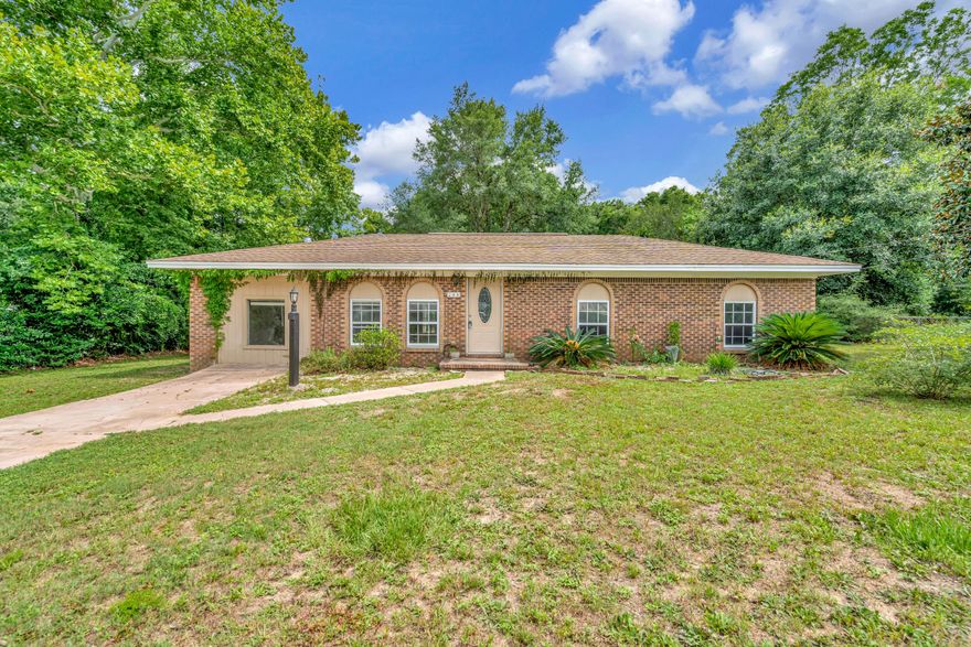 Assumable loan at 4.5%! Whether you're VA-eligible or not, the seller is open to all qualified buyers and ready to make a deal happen. This motivated seller values a smooth, win-win transaction--don't miss your chance to secure a great rate and a great home. This charming 3-bedroom, 1-bath all-brick home offers close to 1,500 sq ft of living space, including a converted garage ideal for a bonus room or office. Situated on nearly half an acre, it features front and back yard fencing, a large shed, and attic storage. Recent updates include new LVP flooring and fresh paint throughout. Enjoy a spacious kitchen, no HOA, and a quiet neighborhood with excellent schools. Convenient to military bases, beaches, and shopping. Move-in ready and priced to sell! ***Buyer's Agents: Bring your clients, we're happy to work with you!***