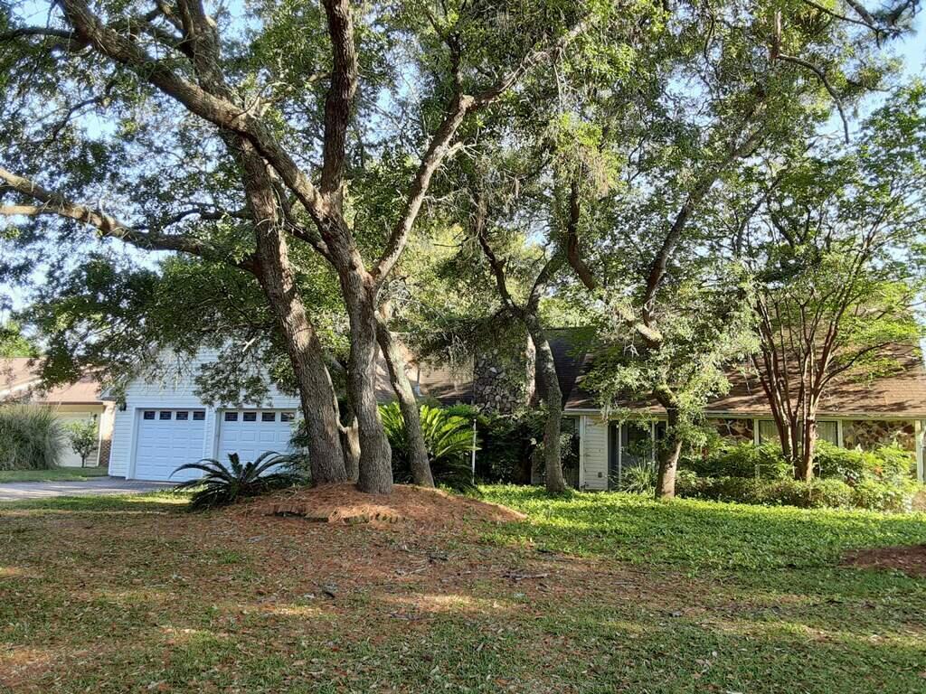 Incredible opportunity to live in one of the most desirable neighborhoods of Shalimar and right on the golf course. The house has an open floorplan - an inviting living room with a fireplace, kitchen, and a large Florida room. Spacious master suite is on the first floor and has incredible views of the golf course. Two additional bedrooms are upstairs and share a bathroom. Oversized garage offers a lot of storage and might accommodate a golf cart. High roofline opens great potential for expansion. The house sits on a large lot with mature trees and has a backyard that can accommodate a swimming pool. The house has been occupied by a tenant for several years and needs TLC.