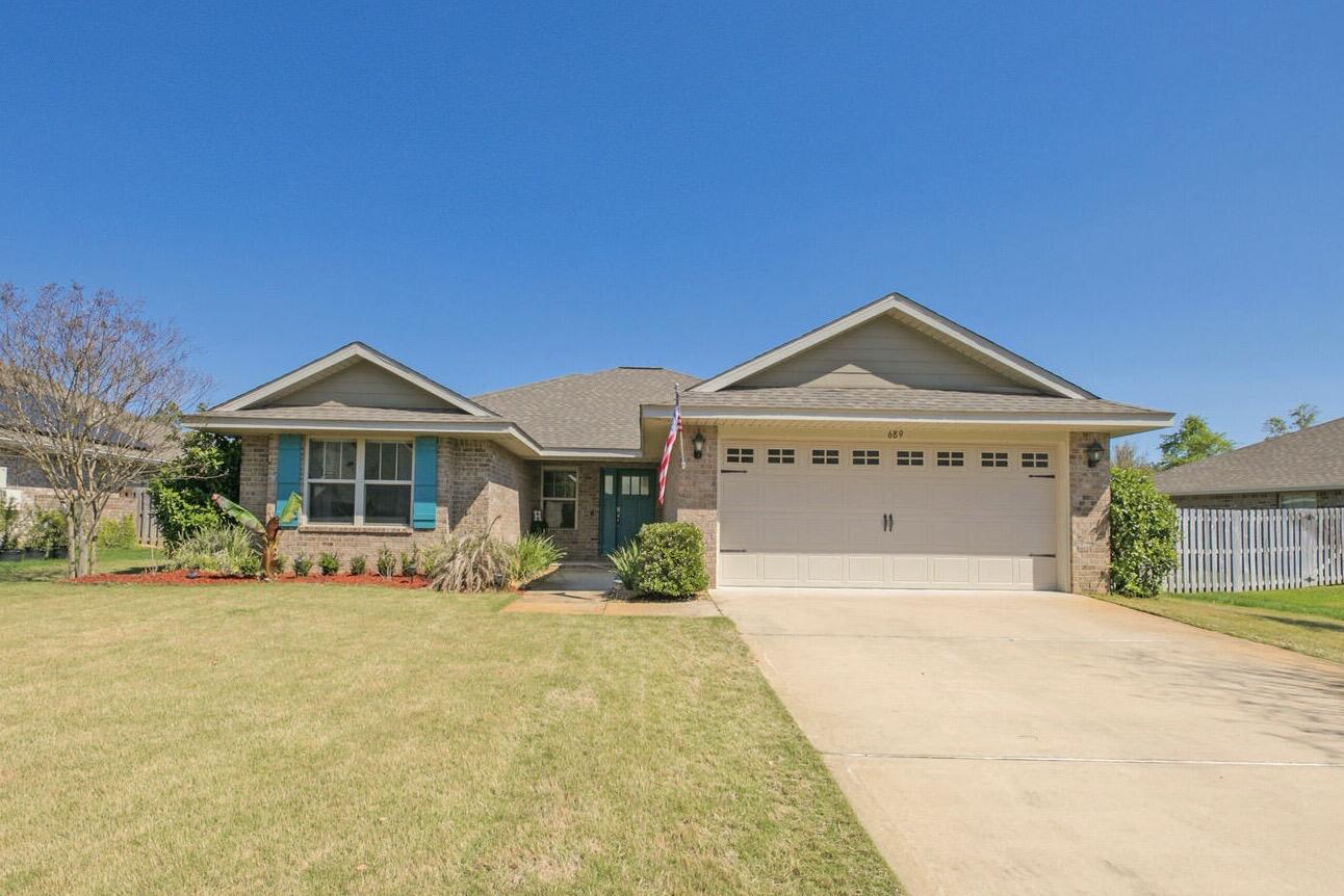 OPEN HOUSE Saturday April 9 11am-3pm. Waterfront Hammock Bay living in the highly sought after Symphony neighborhood! Only 17 miles to 30A and its renowned Emerald Coast beaches.Drink in the tranquil water views from your covered back patio in a fully fenced back yard. Enjoy your morning coffee at the Granite Breakfast Bar. Relish a quiet moment in the Primary Suite's separate Garden tub. Crafted with hardwood floors in the main living areas, and granite countertops throughout. The Primary Suite is elevated with a walk-in closet, crown molding, & a trey ceiling. Your investment is protected with installed gutters & lawn irrigation. The ring doorbell & back yard camera will convey. Flood zone ''x'' offers peace of mind. This all-brick home is energy efficient with a tankless water heater.